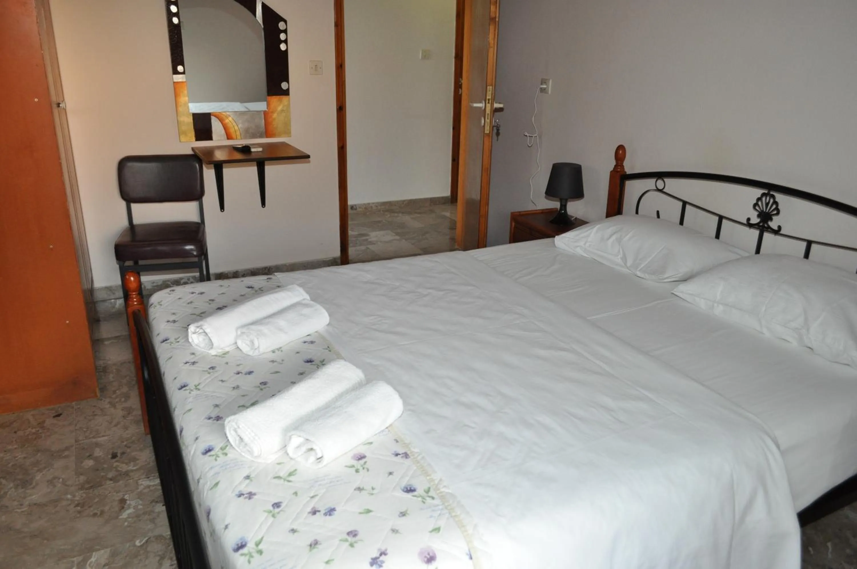 Photo of the whole room, Bed in Olympion Village Studios