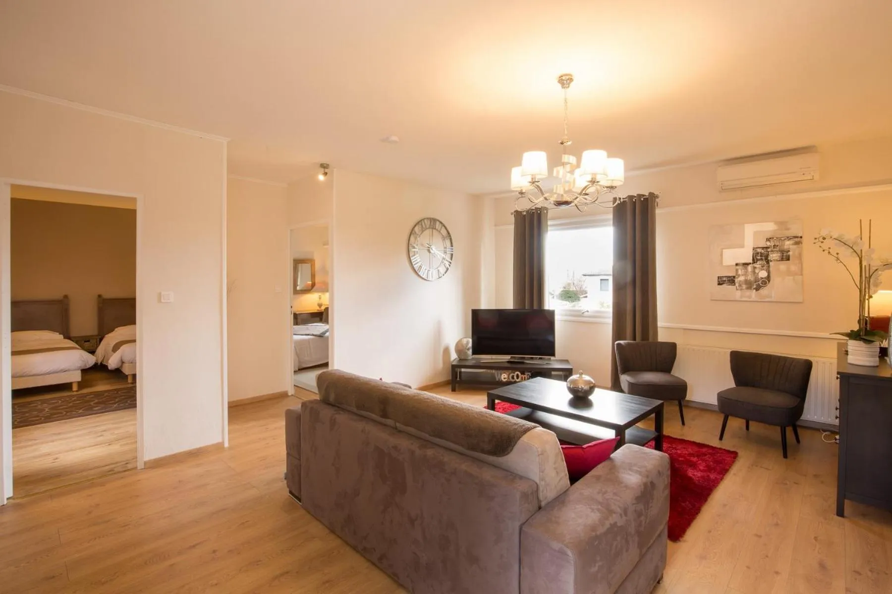 Living room, Bed in Logis Hotel Le Petit Casset