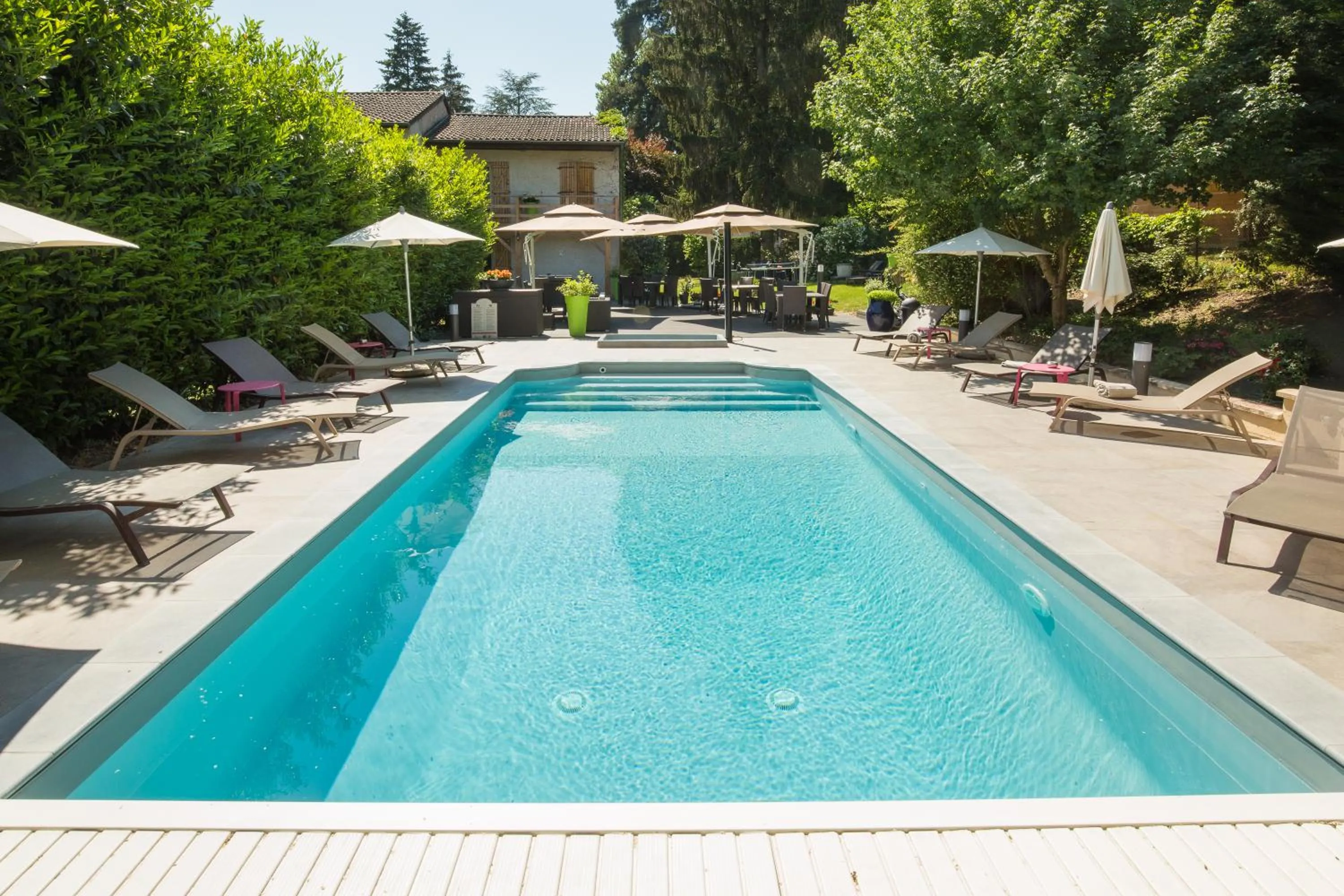 Swimming pool in Logis Hotel Le Petit Casset