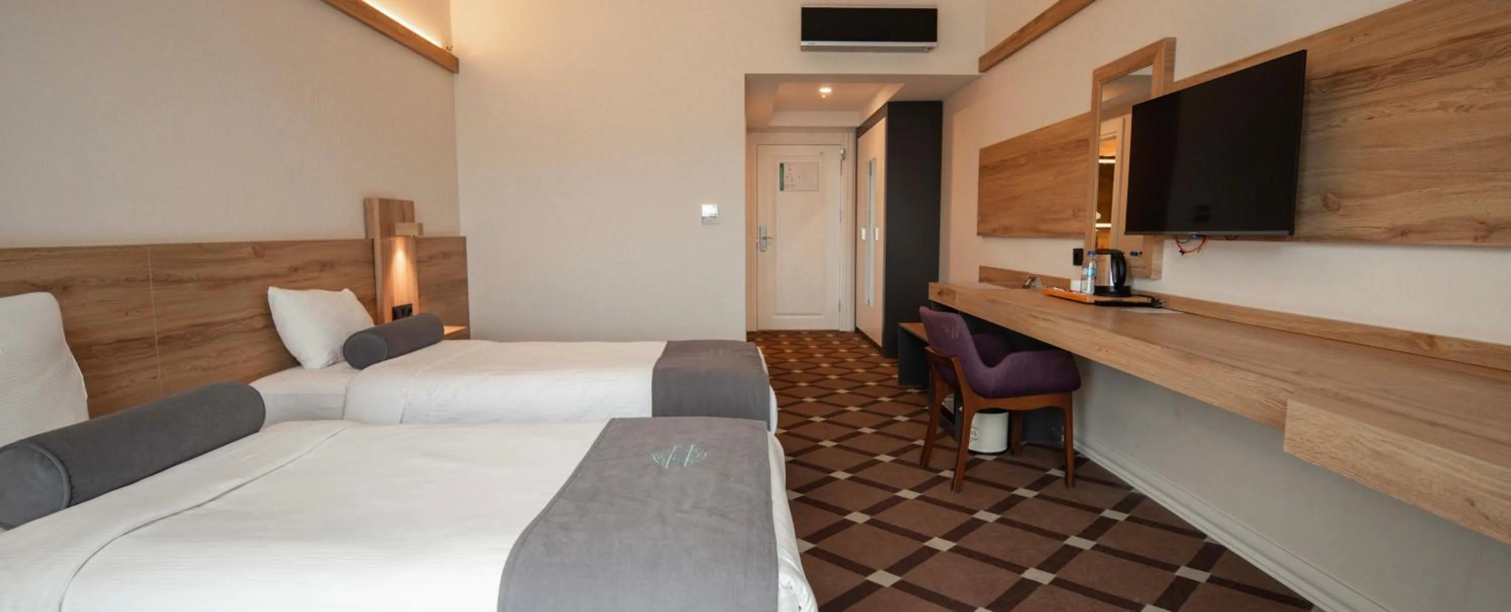 Bed in Karpalas City Hotel & Spa