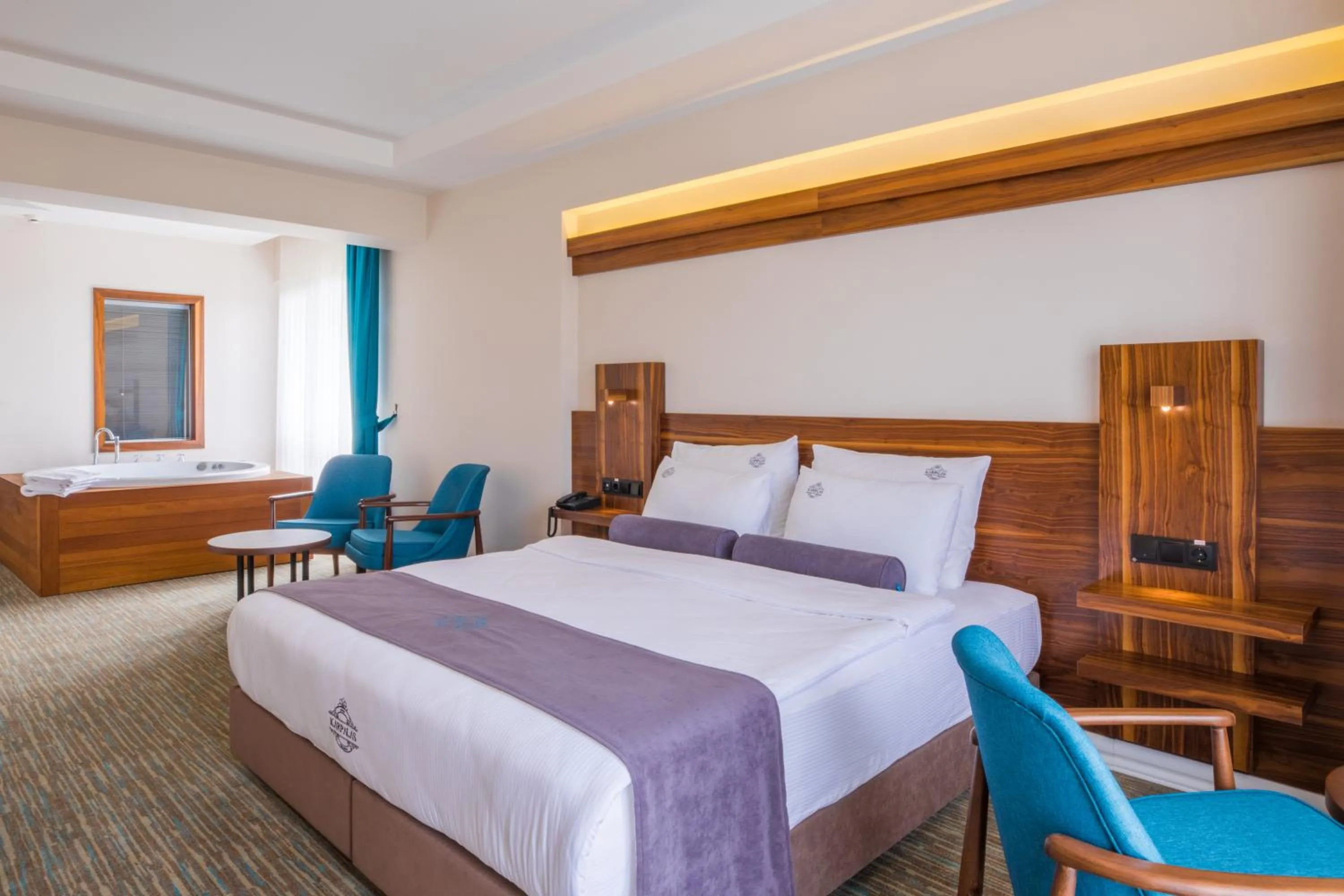 Bed in Karpalas City Hotel & Spa