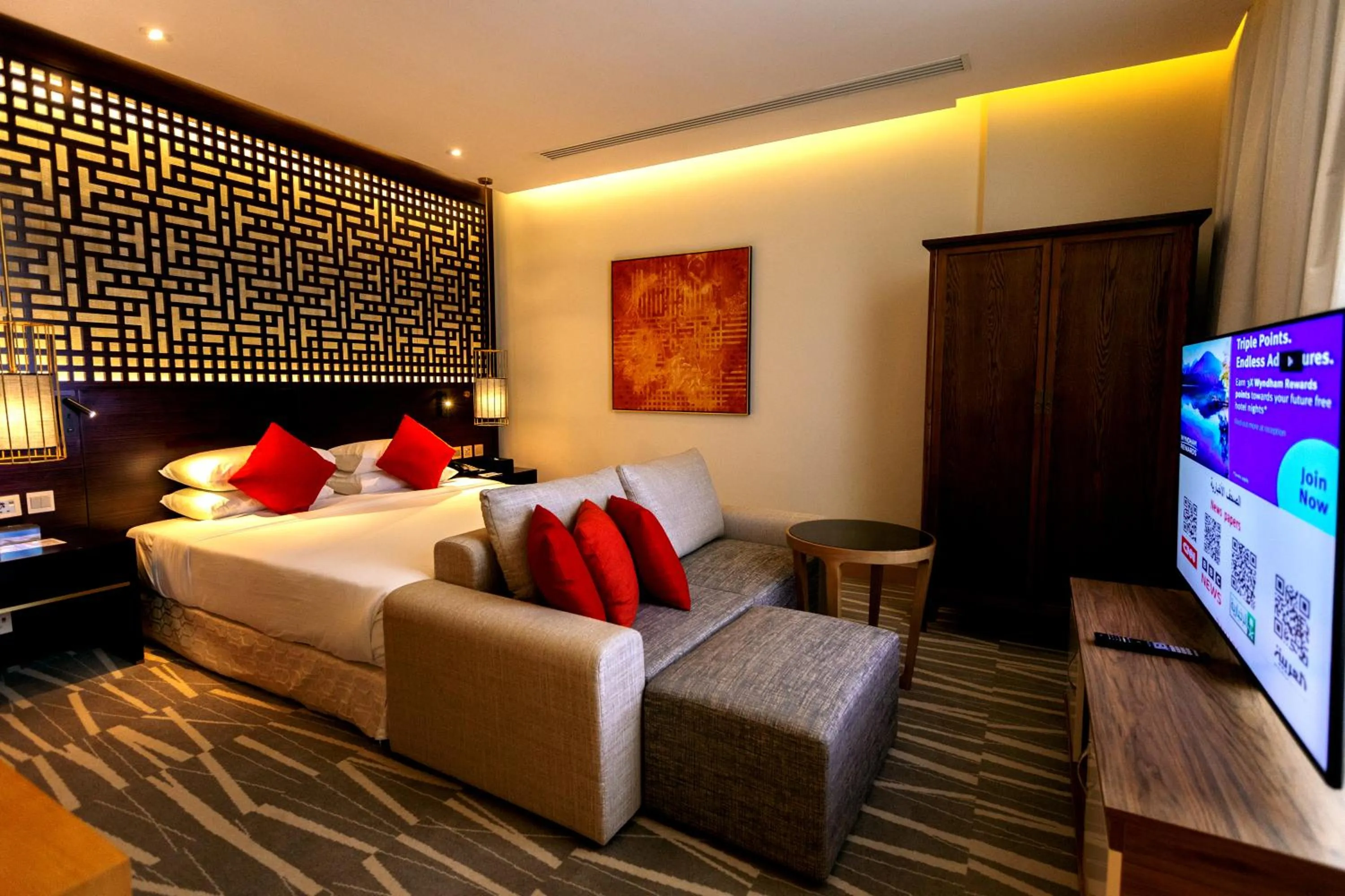 Bedroom, Bed in Ramada Hotel & Suites by Wyndham Al Qassim