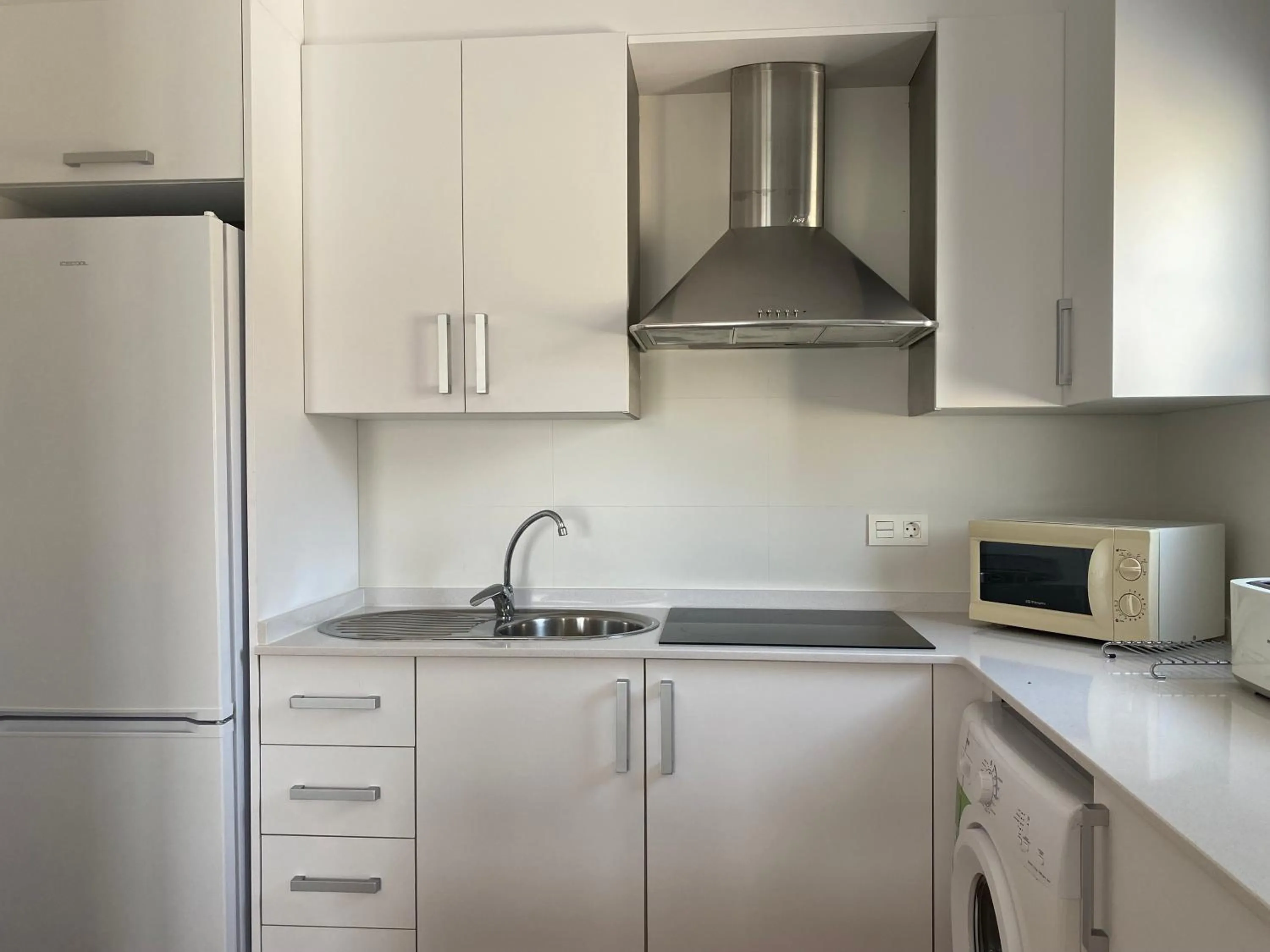 Kitchen or kitchenette in Apartahotel Vistamar San José