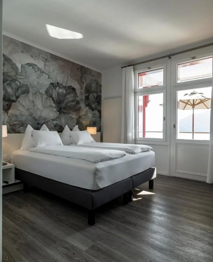 Bed in Hotel Vitznauerhof - Lifestyle Hideaway at Lake Lucerne