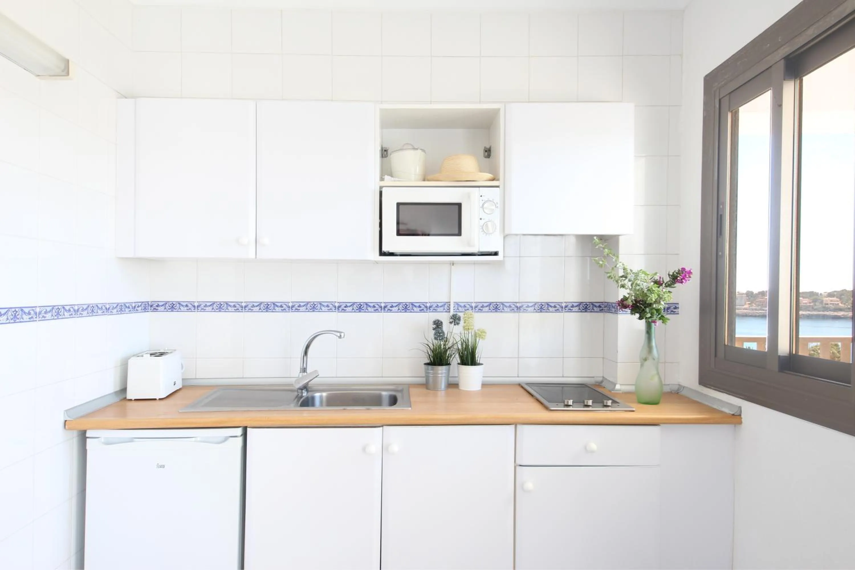 Kitchen or kitchenette in Aparthotel Niu d´Aus