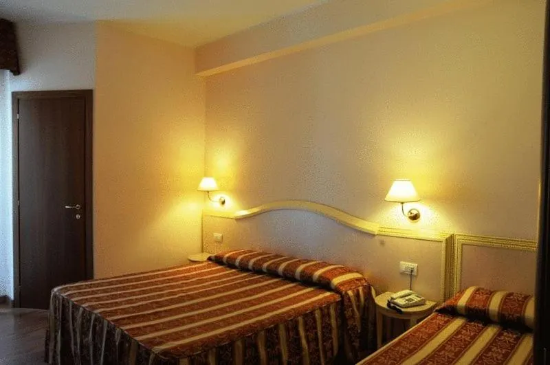 Bed in Hotel Corallo