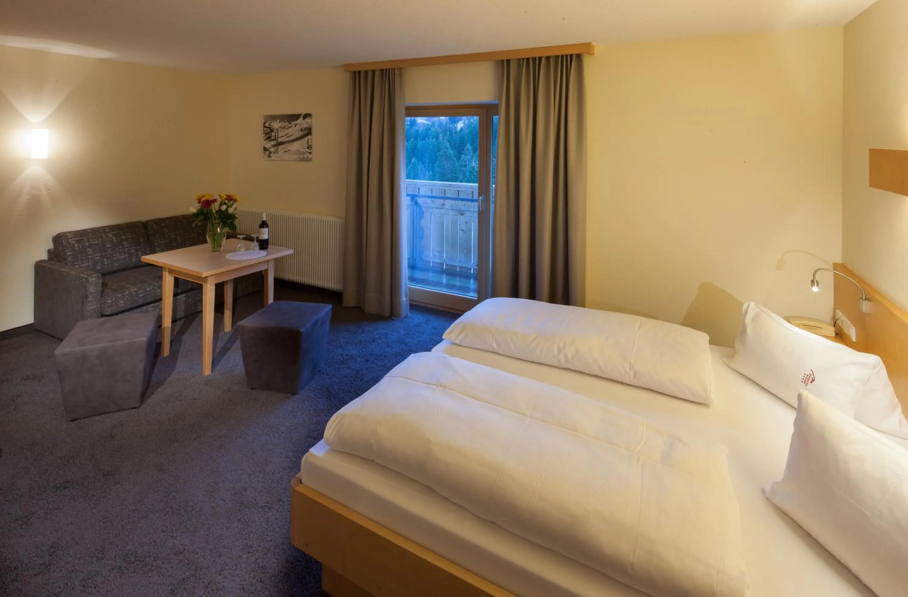 Living room, Bed in Alpine Lifestyle Berghotel Madlener