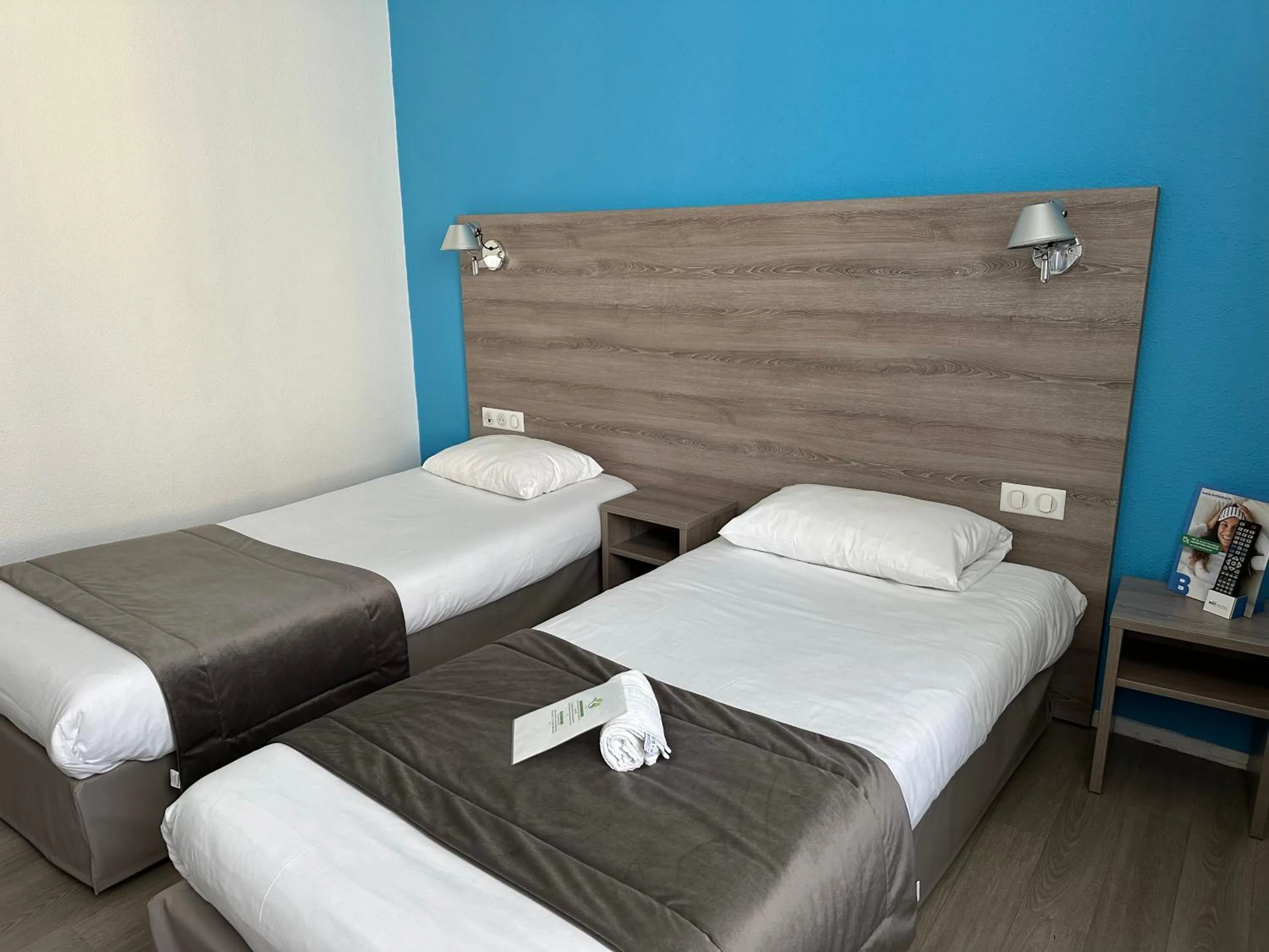 Photo of the whole room, Bed in BRIT HOTEL CONFORT NEVERS Centre Gare