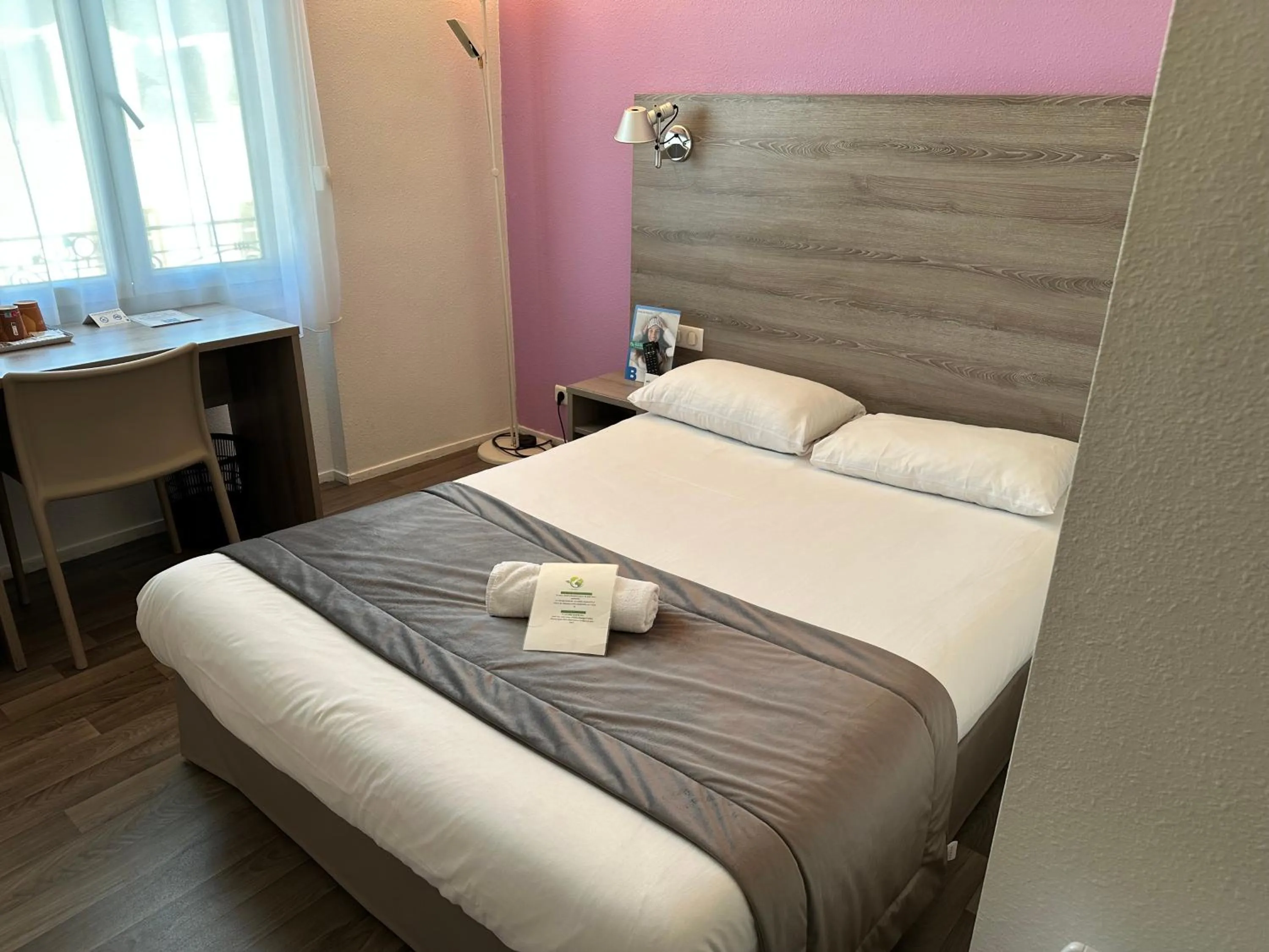 Photo of the whole room, Bed in BRIT HOTEL CONFORT NEVERS Centre Gare