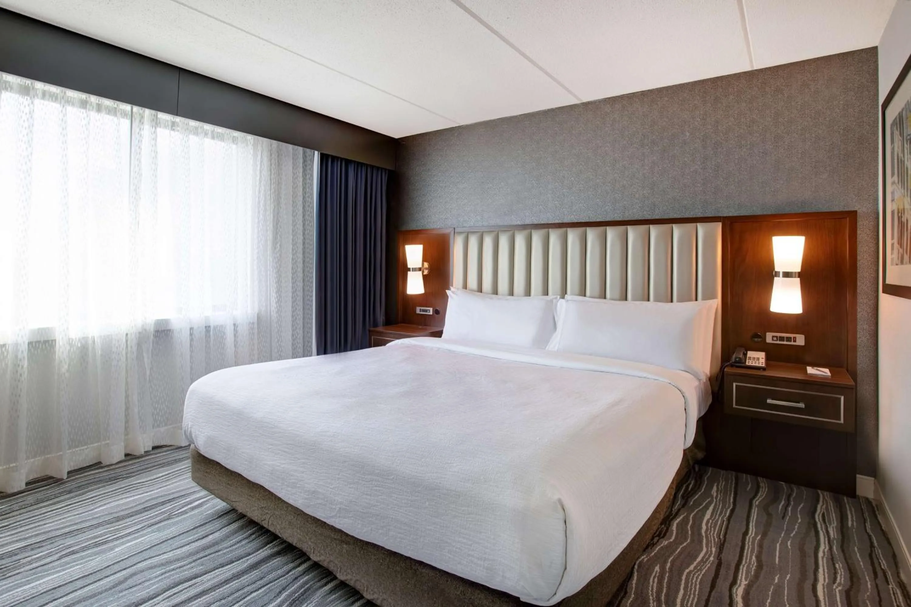 Bed in Embassy Suites Syracuse