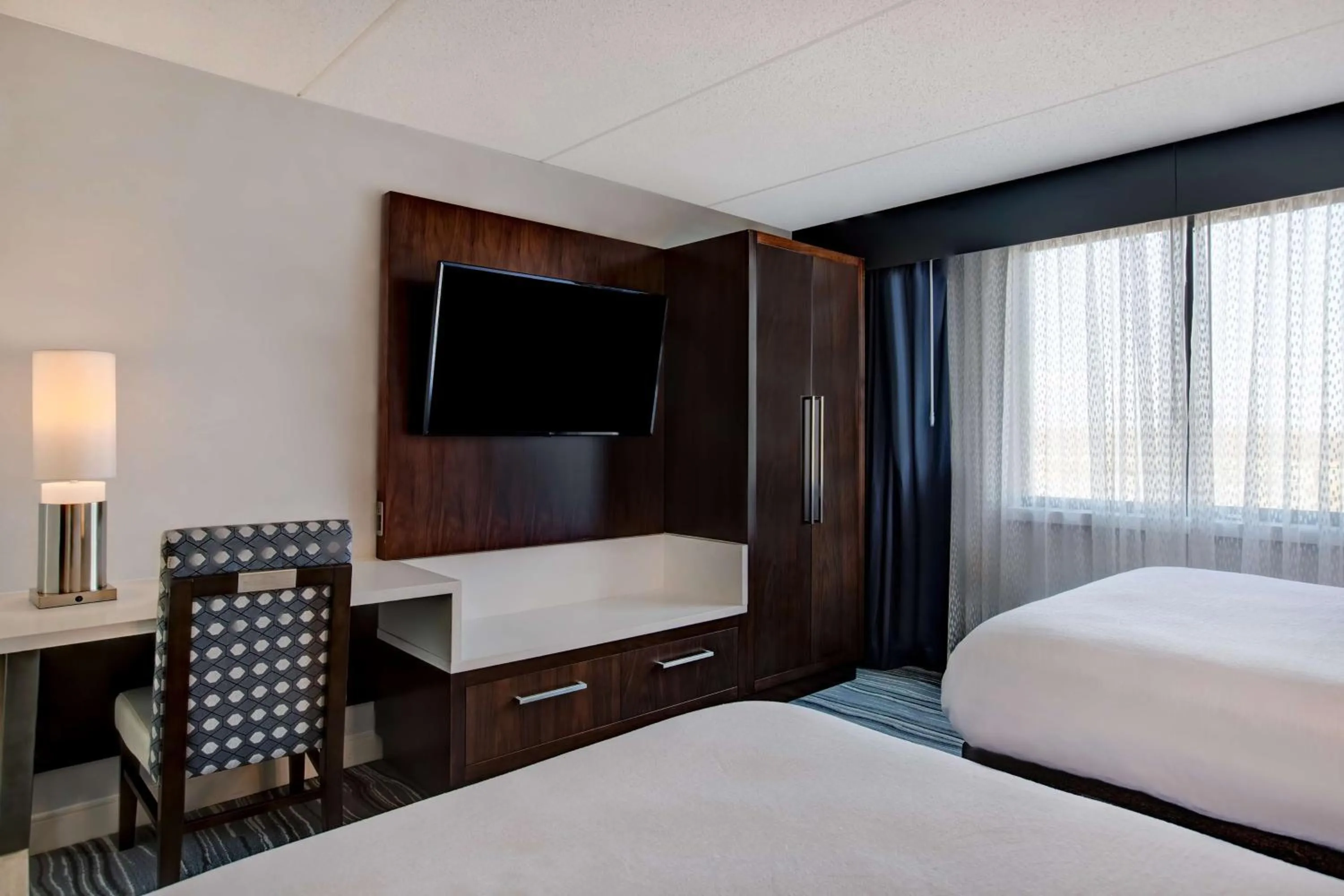 Bed in Embassy Suites Syracuse