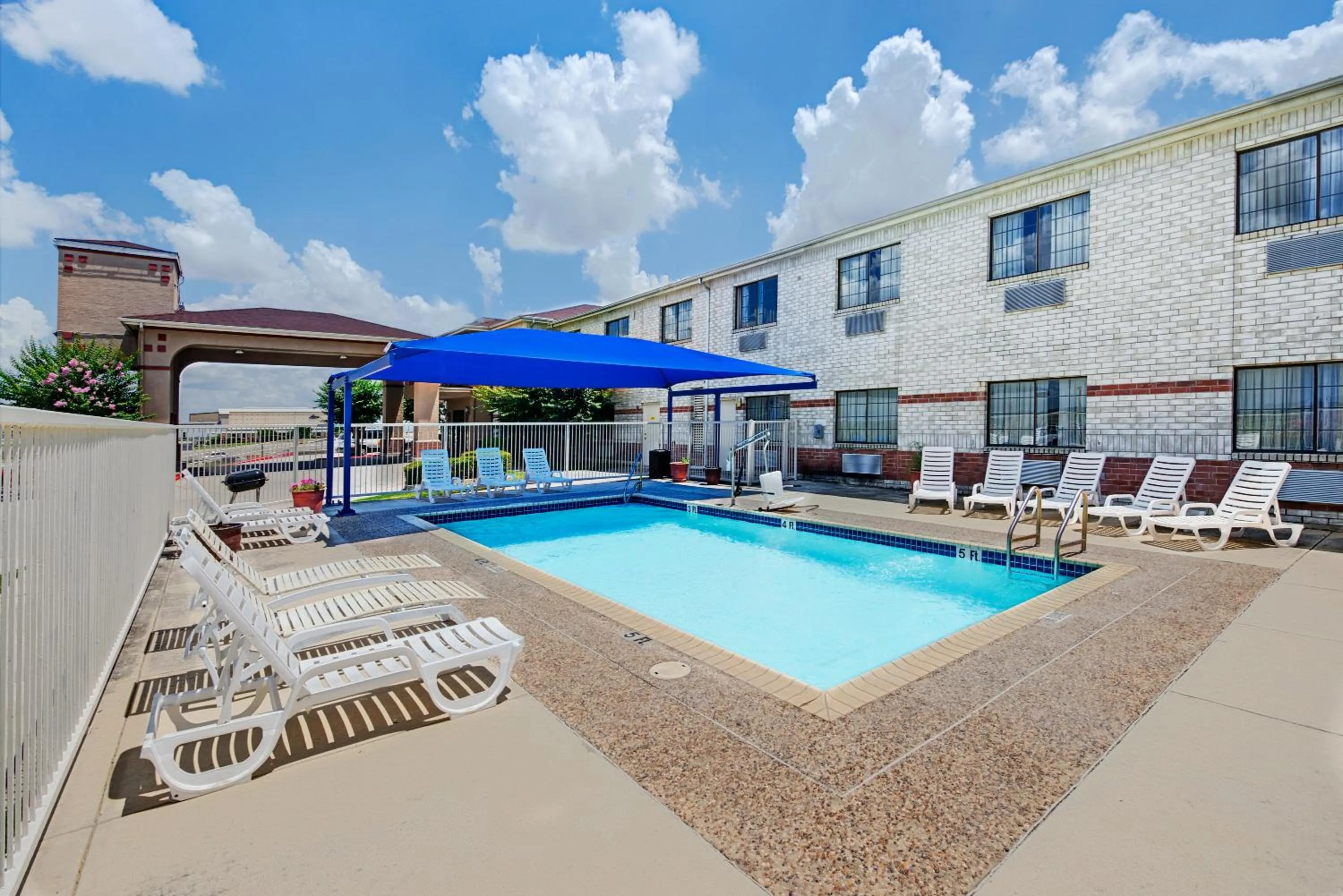 Swimming pool in SureStay Plus by Best Western San Antonio Airport