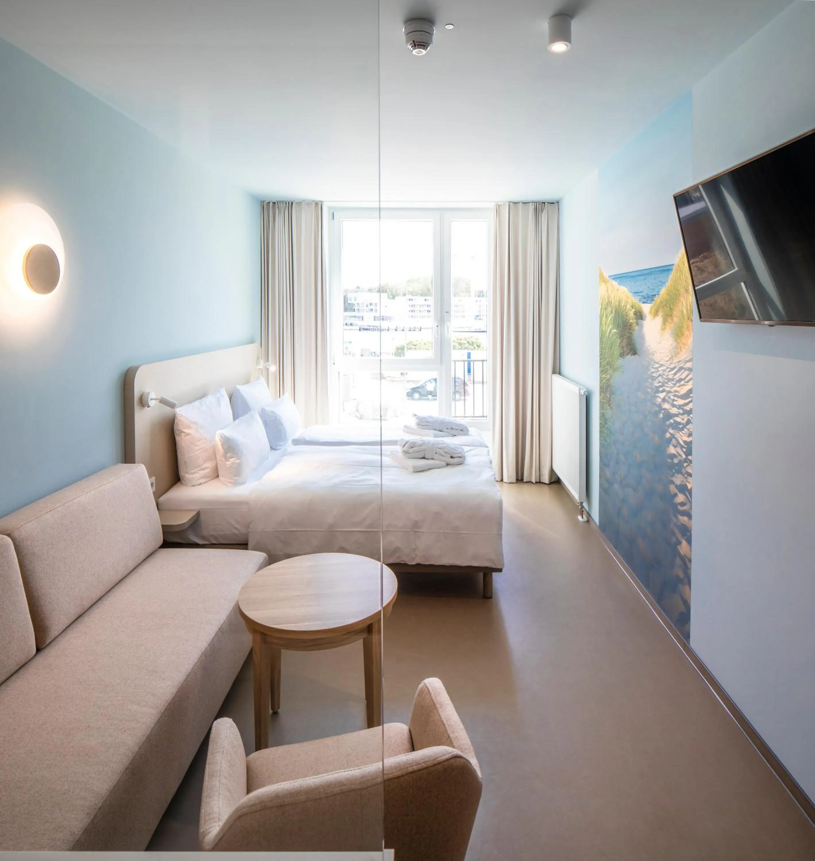 Seating area, Bed in aja Travemünde