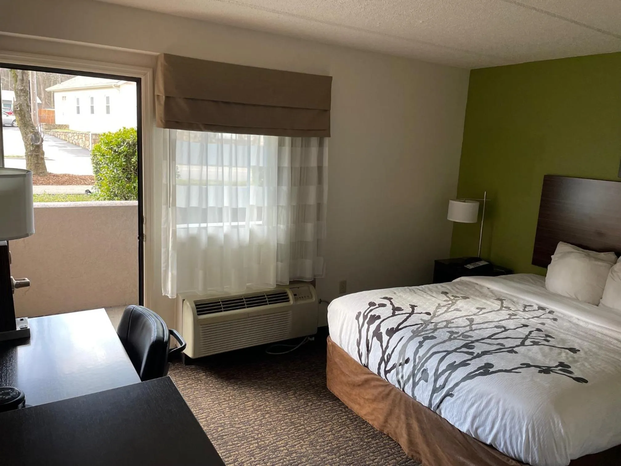 Patio, Bed in Sleep Inn & Suites near Sports World Blvd