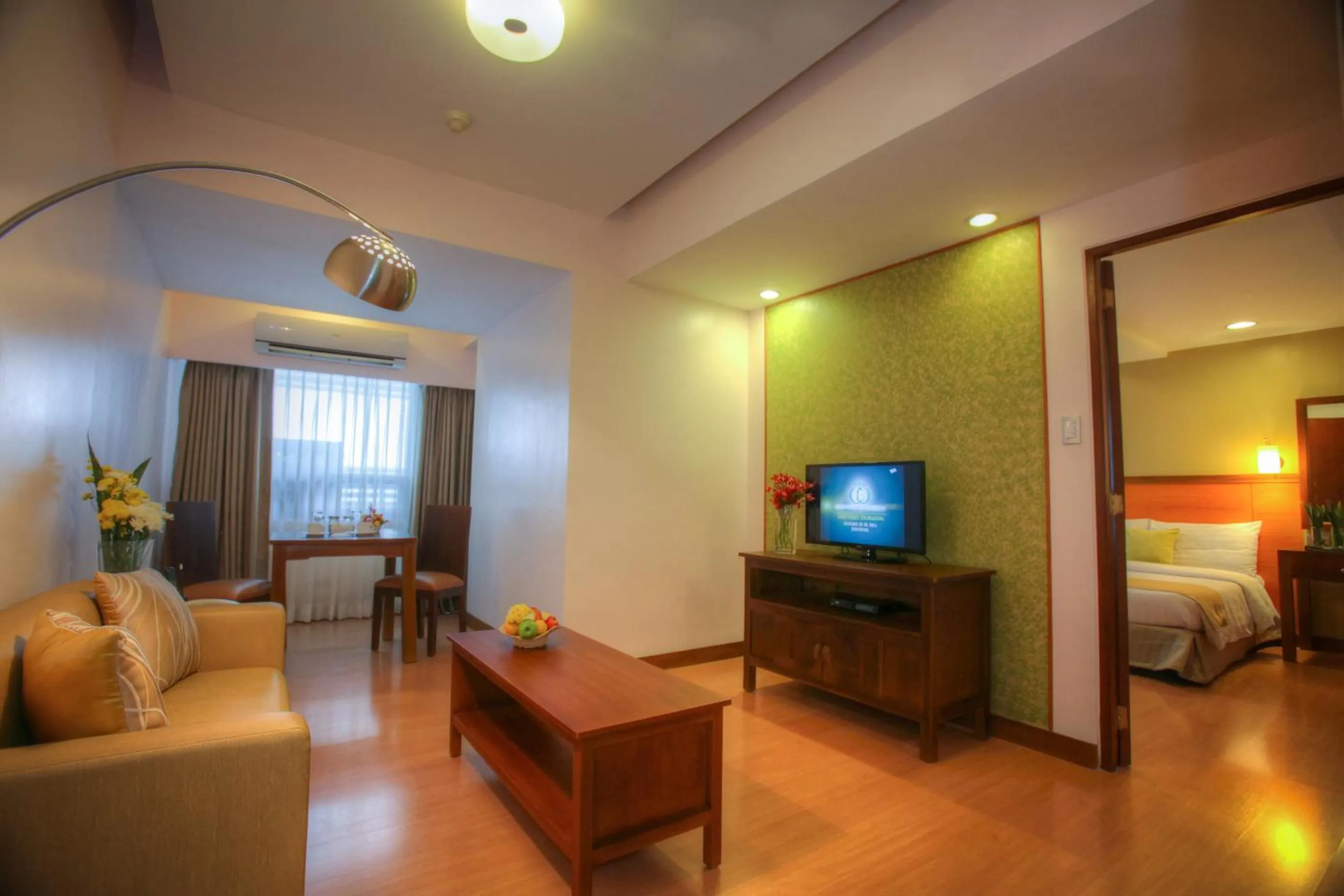 Living room, Bed in The Malayan Plaza Hotel