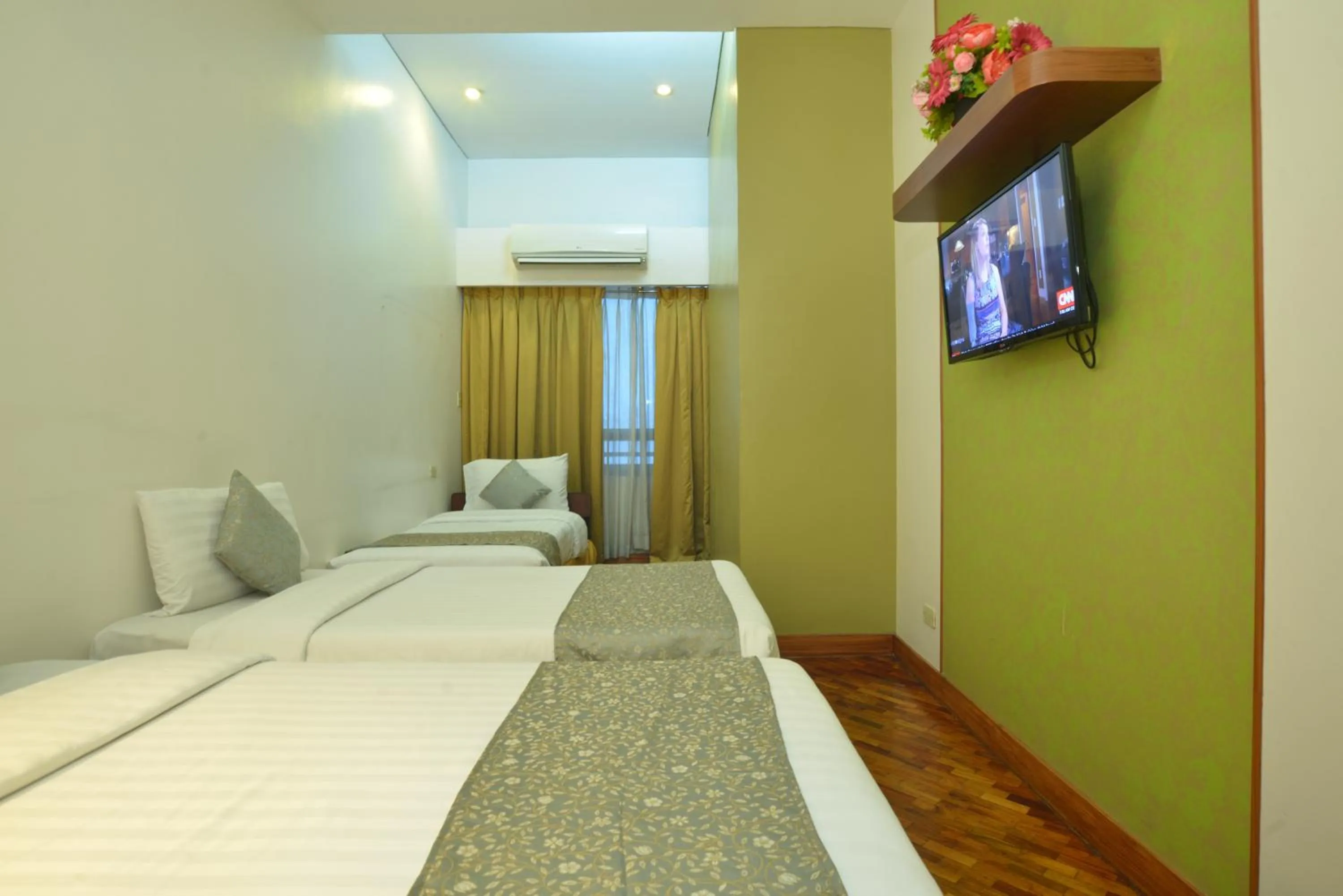 Photo of the whole room, Bed in The Malayan Plaza Hotel