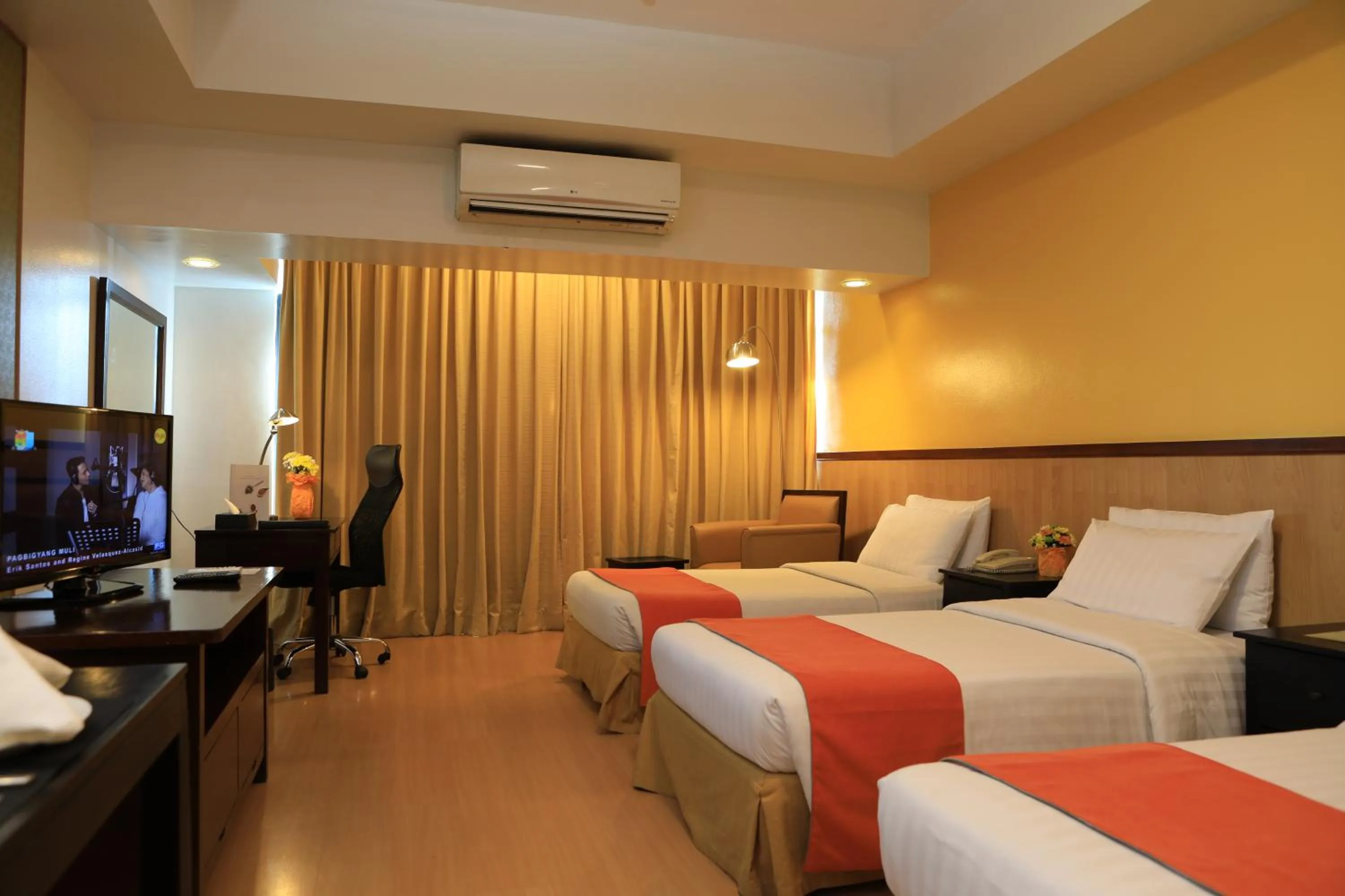 Photo of the whole room, Bed in The Malayan Plaza Hotel