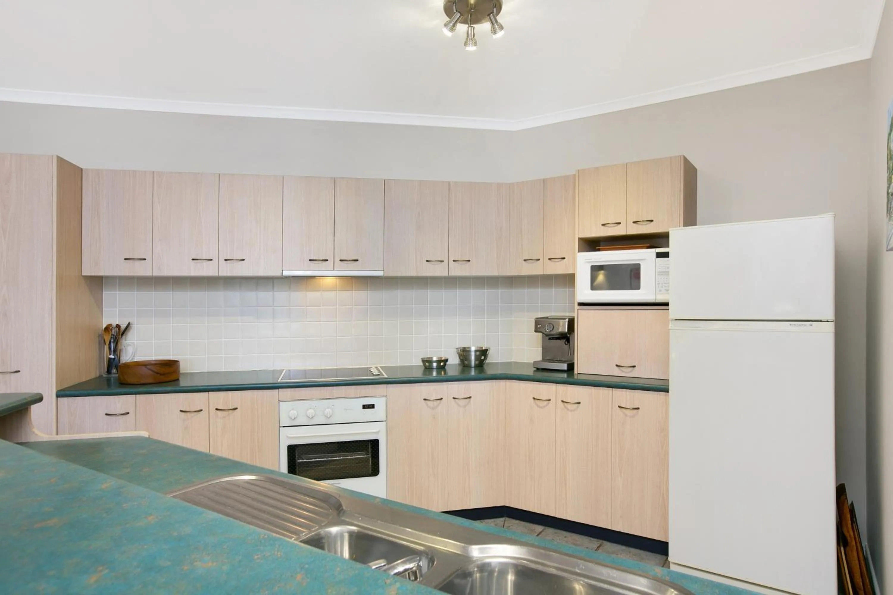 Kitchen or kitchenette in Trinity Waters Boutique Beachfront