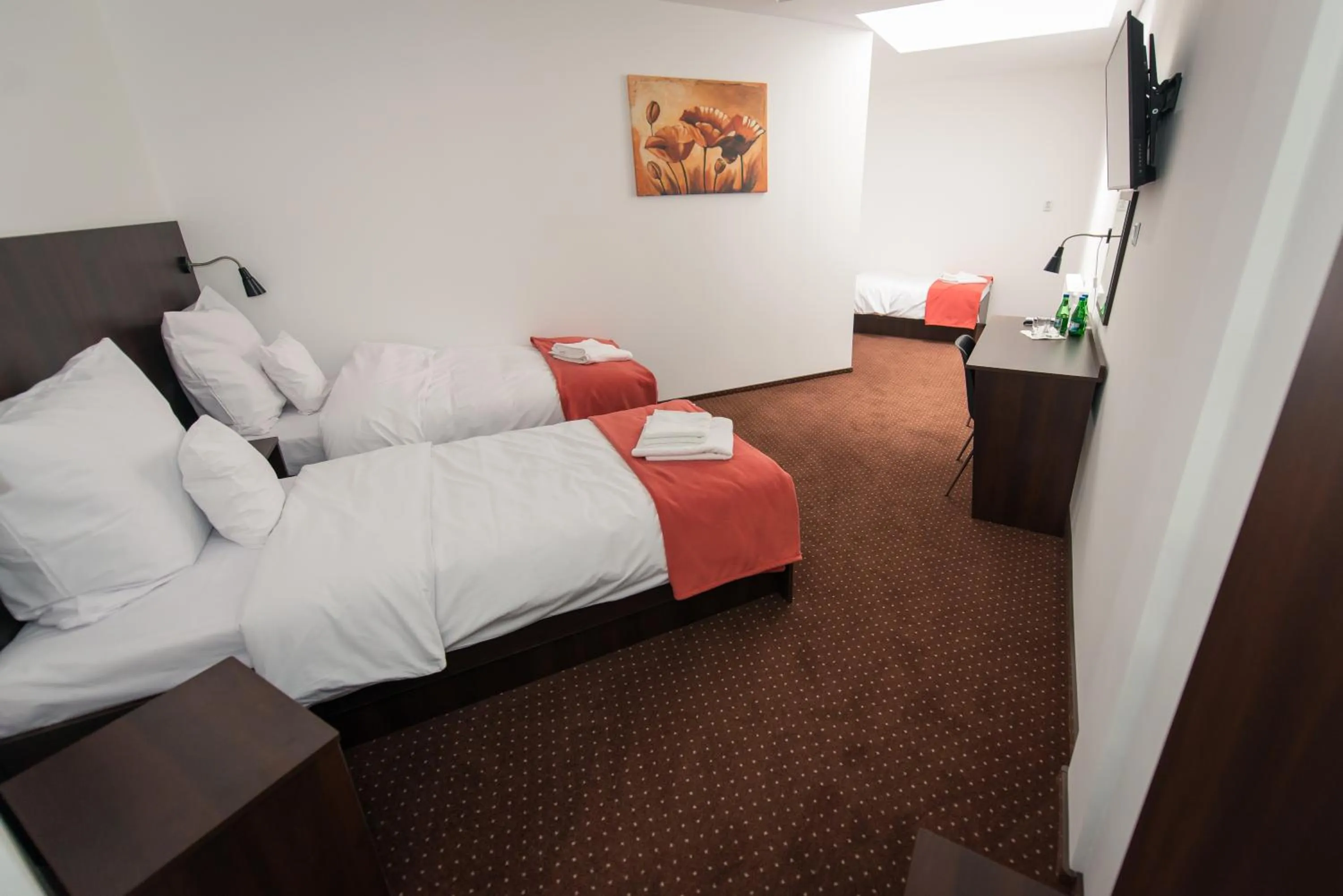 Photo of the whole room, Bed in First Hotel