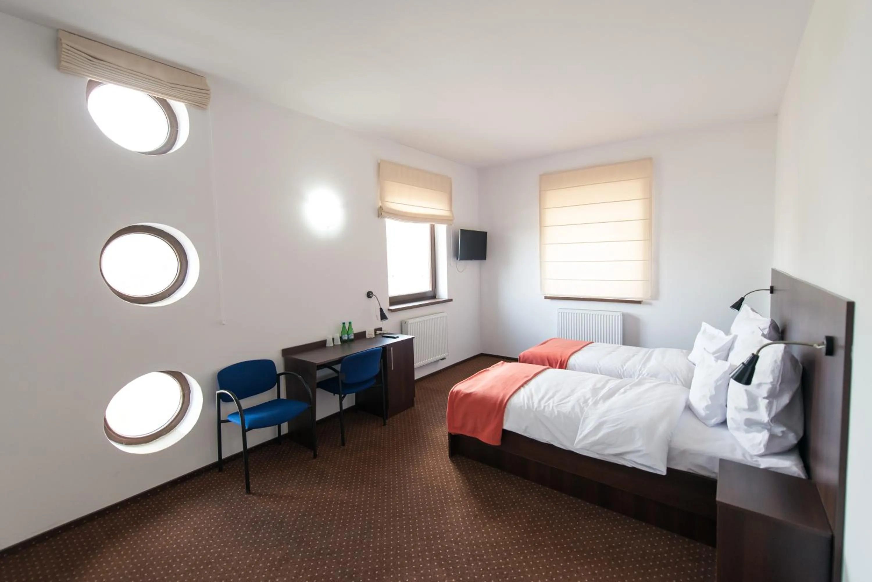 Photo of the whole room, Bed in First Hotel