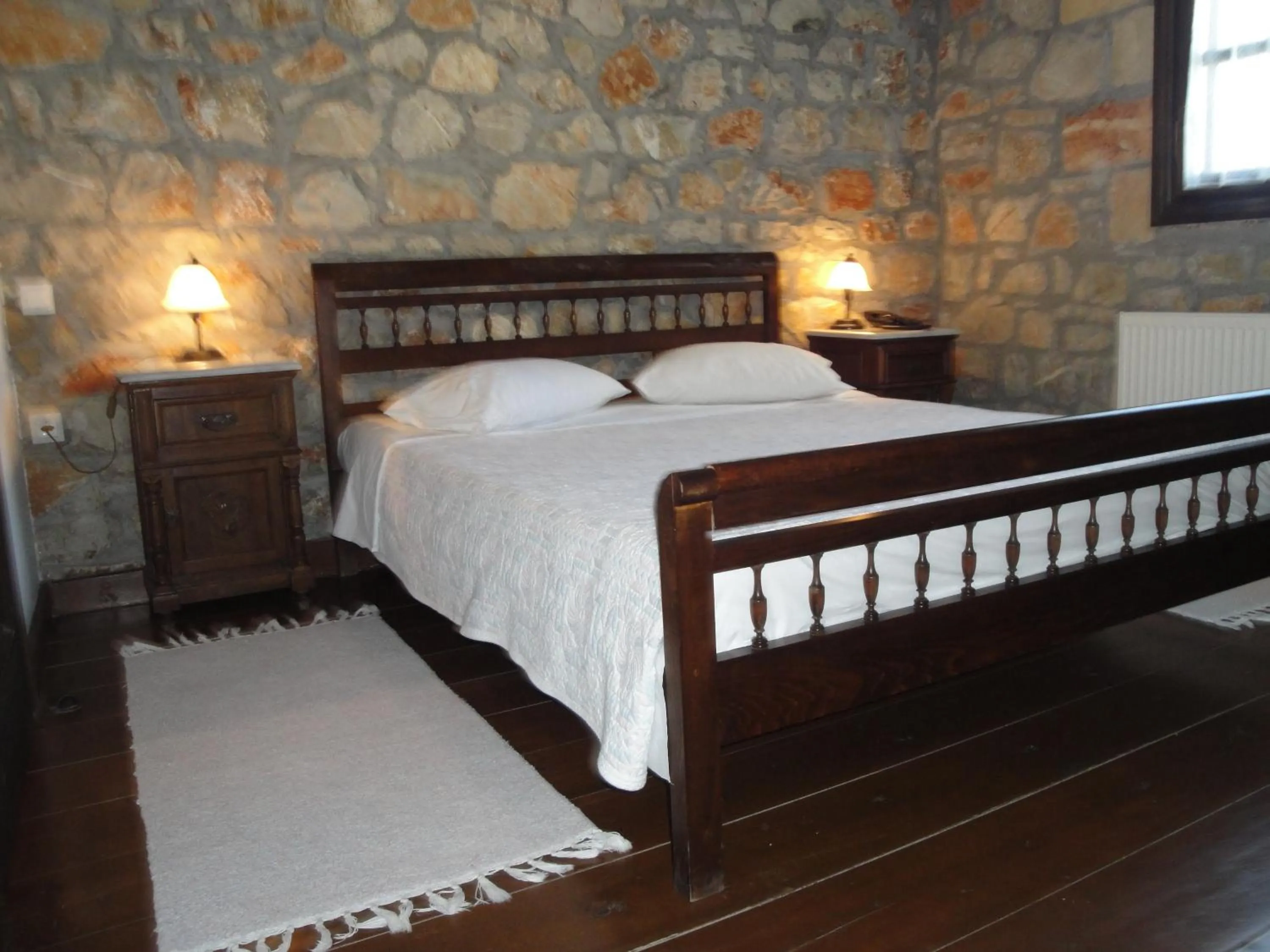 Bed in Klymeni Traditional Homes