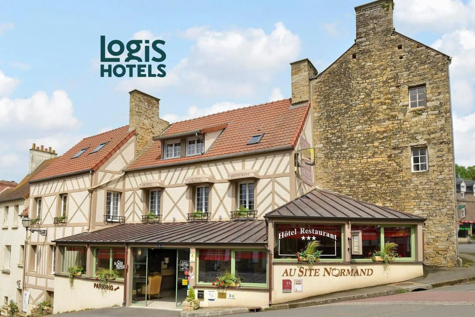 Property building in Logis Hotel Spa Restaurant Au Site Normand