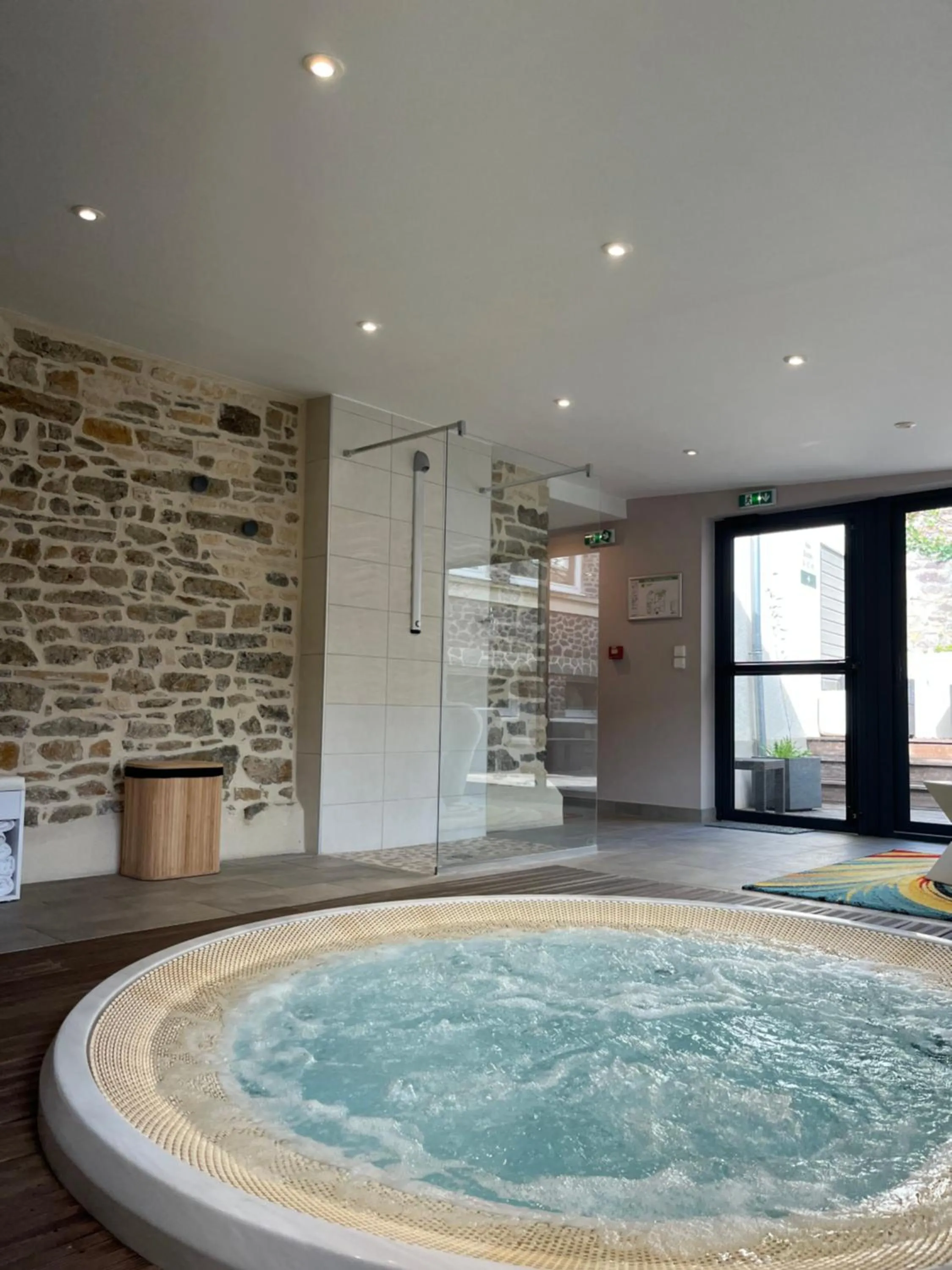 Hot Tub in Logis Hotel Spa Restaurant Au Site Normand