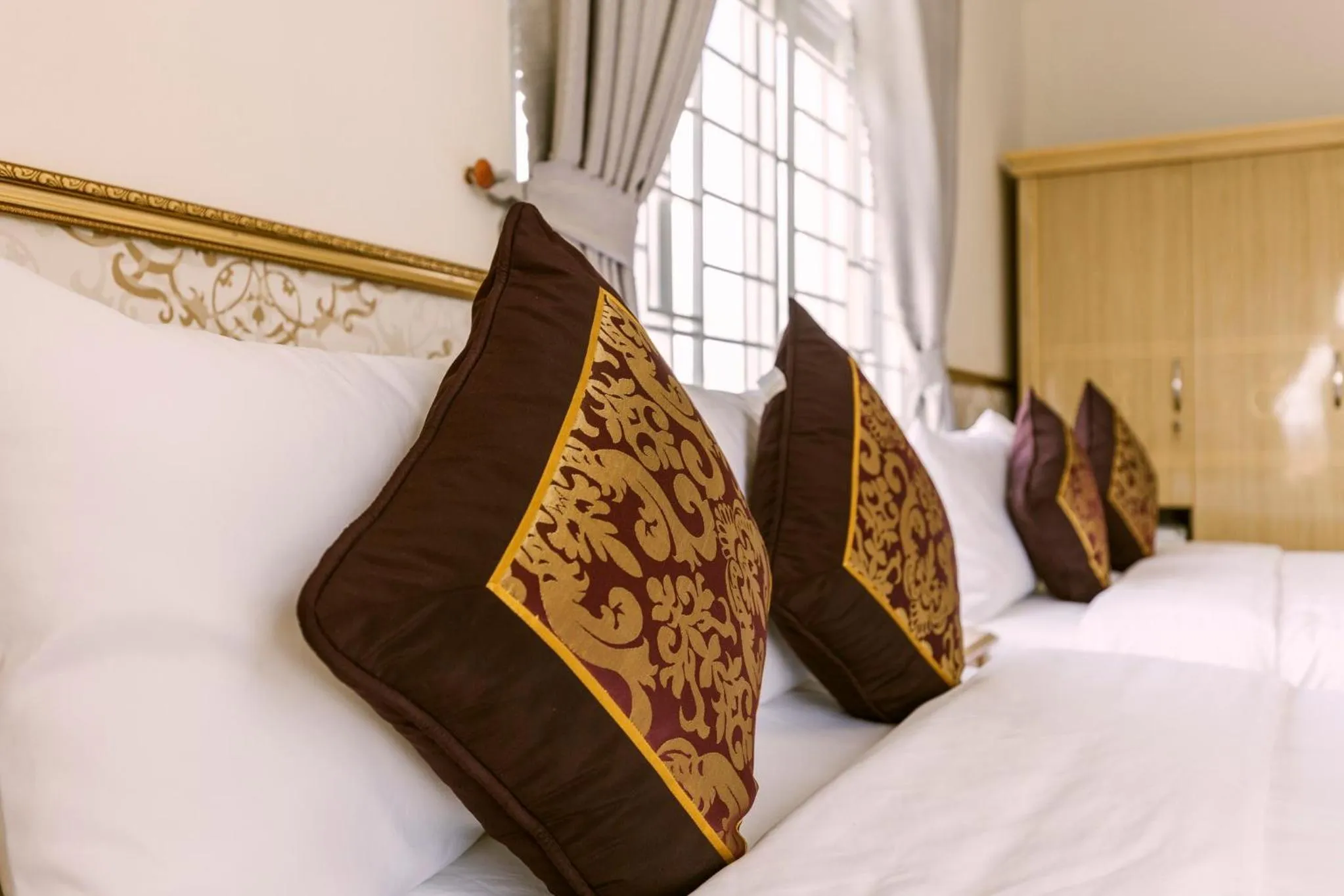 Bed in AEC Hotel Ban Me