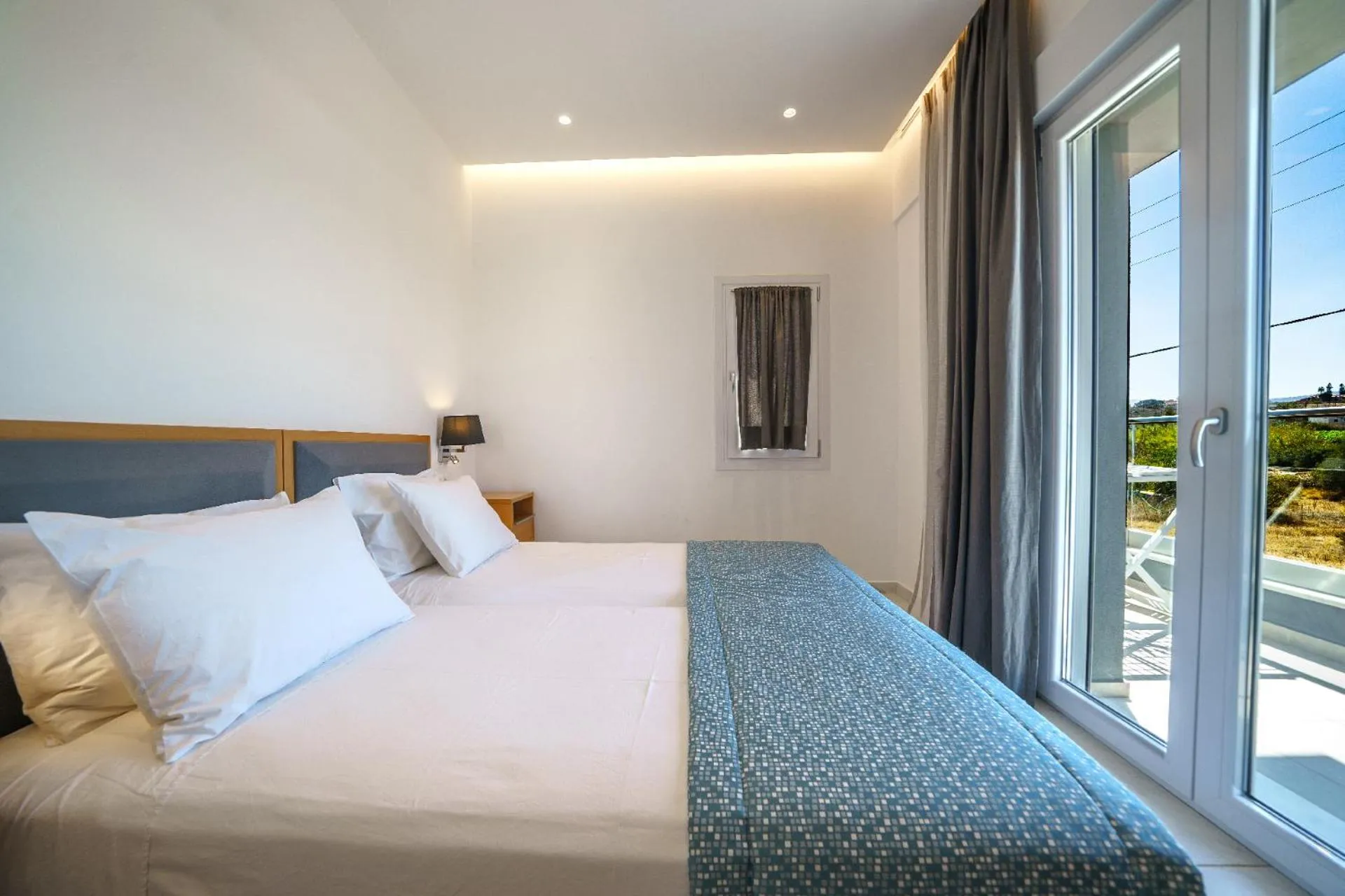 Photo of the whole room, Bed in Elysian Suites