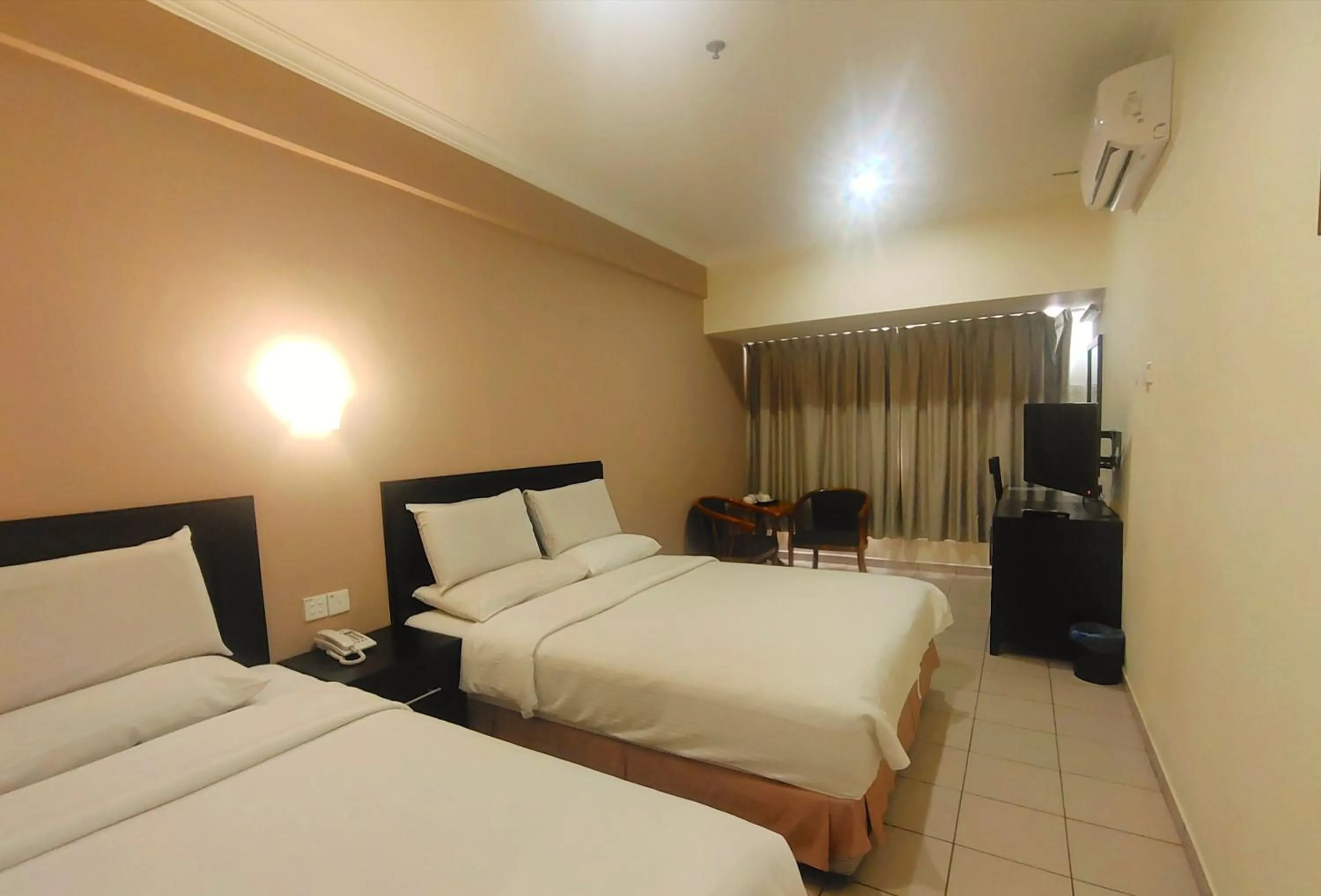 Property building, Bed in Megah D'aru Hotel