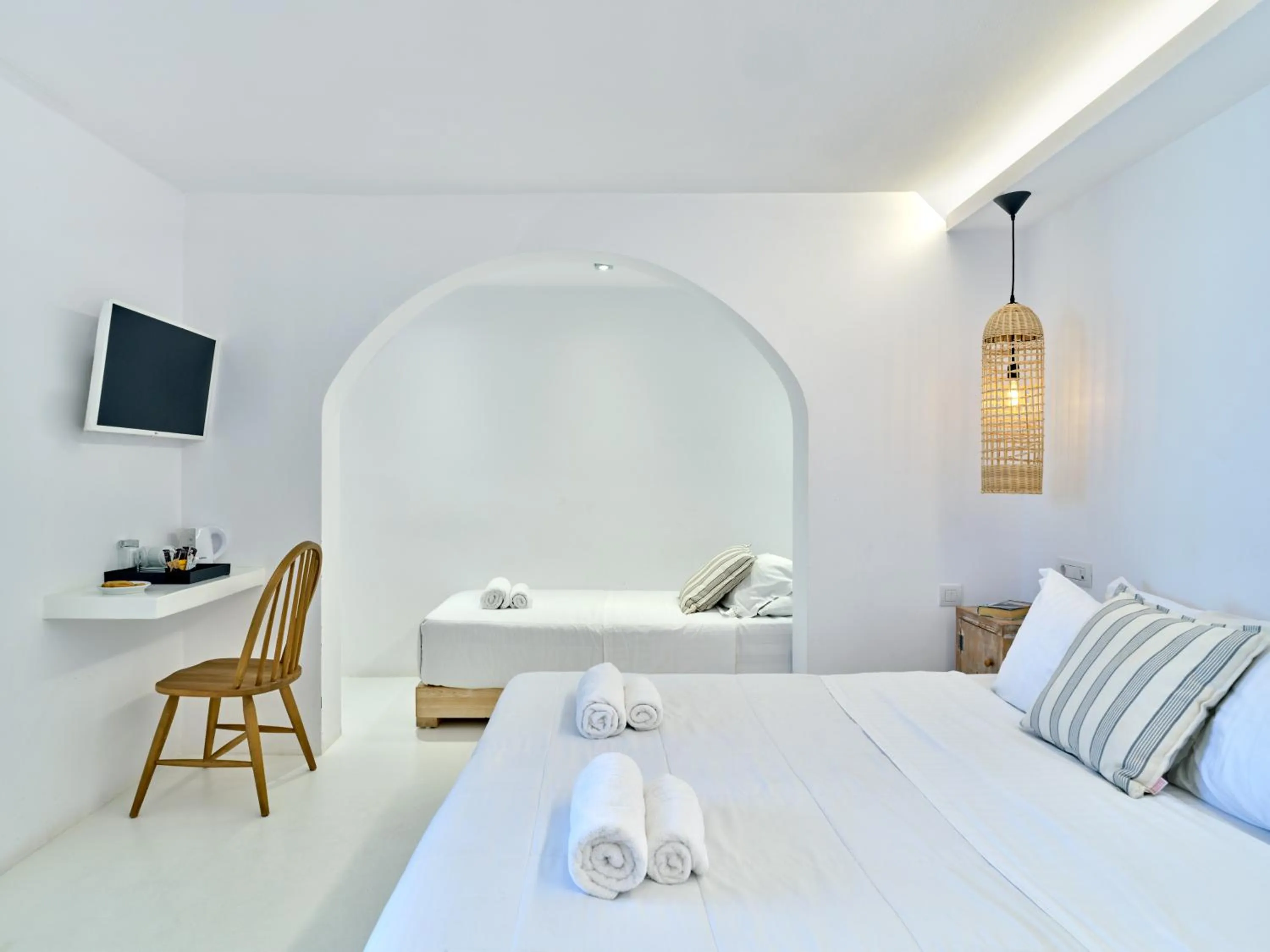 Bed in Zefi Hotel & Suites