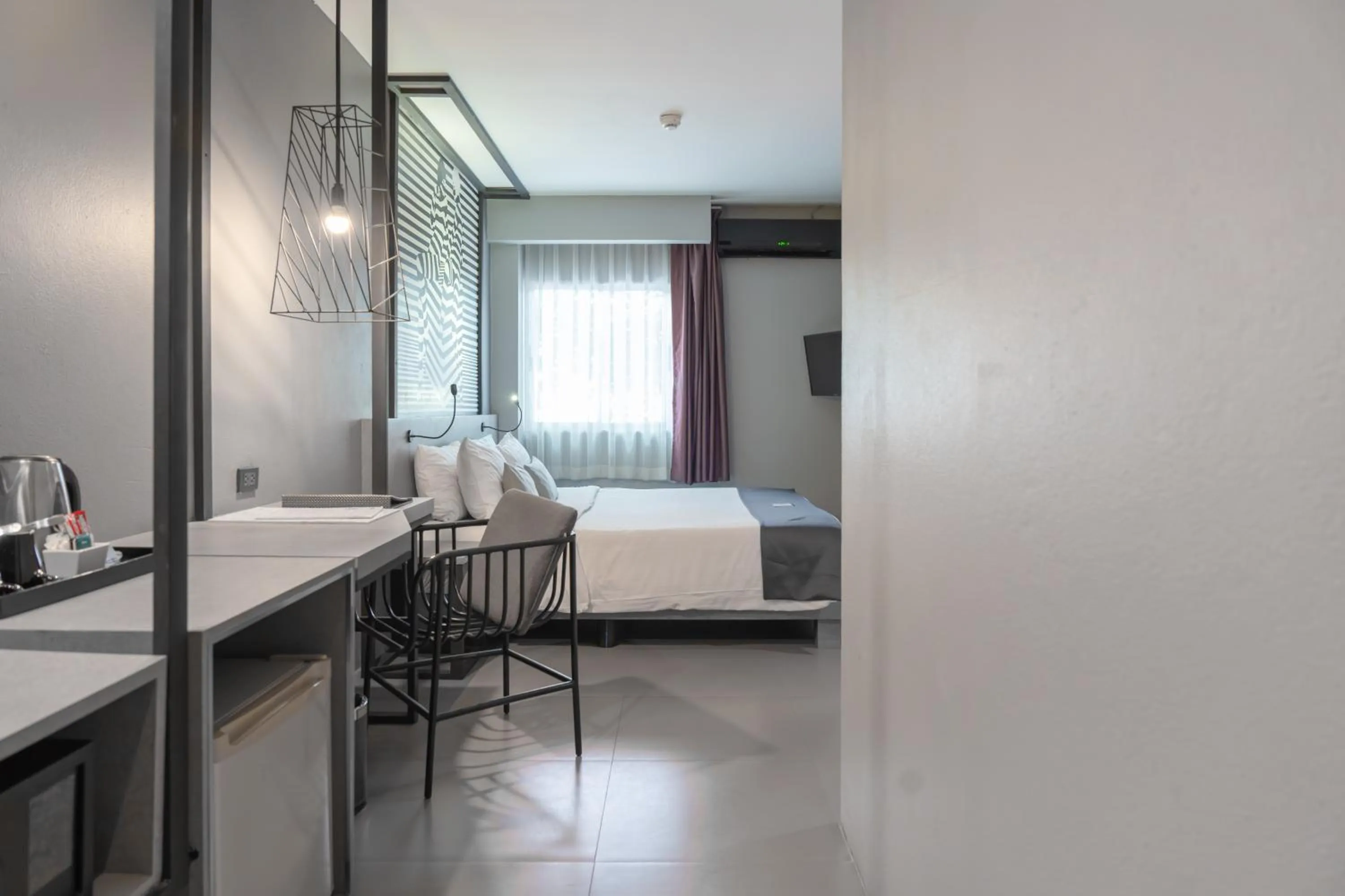 Bed in Mazi Design Hotel by Kalima