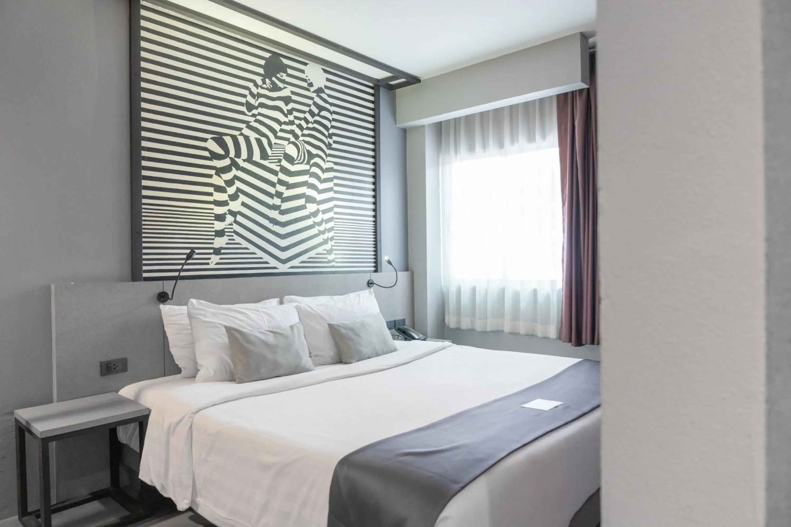 Bed in Mazi Design Hotel by Kalima
