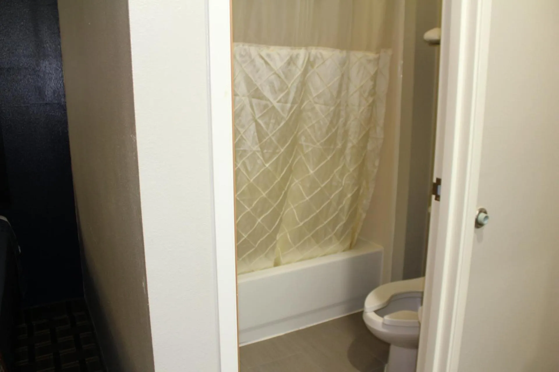 Bathroom in Home Gate Inn & Suites