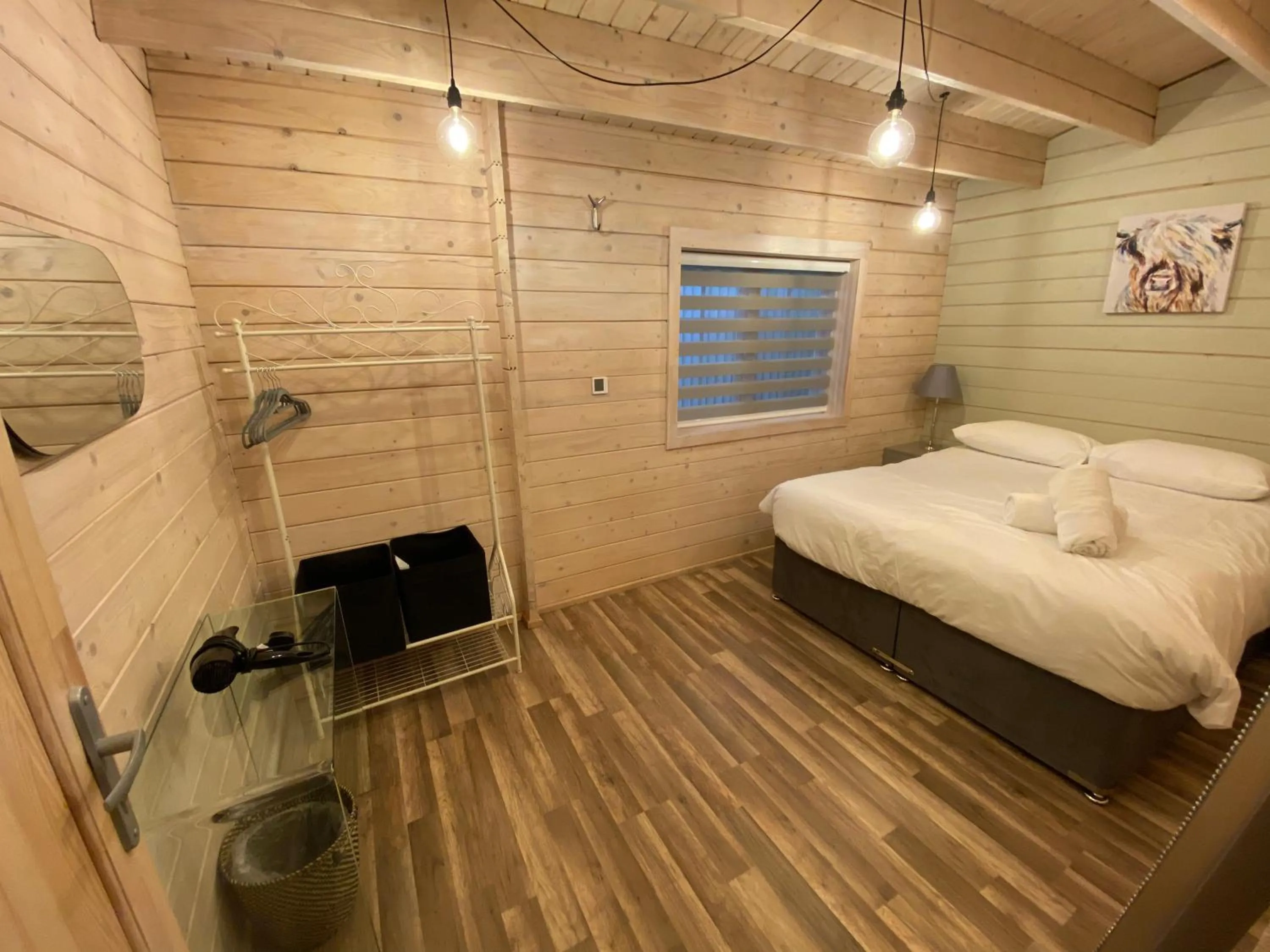 Bed in The Secret Cottage & Hideaway Caravan