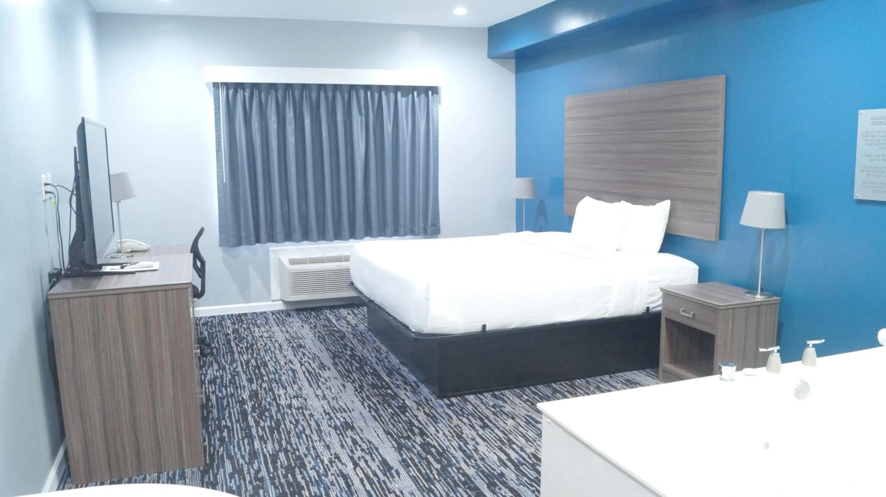 Bed in Magnolia Inn and Suites Olive Branch