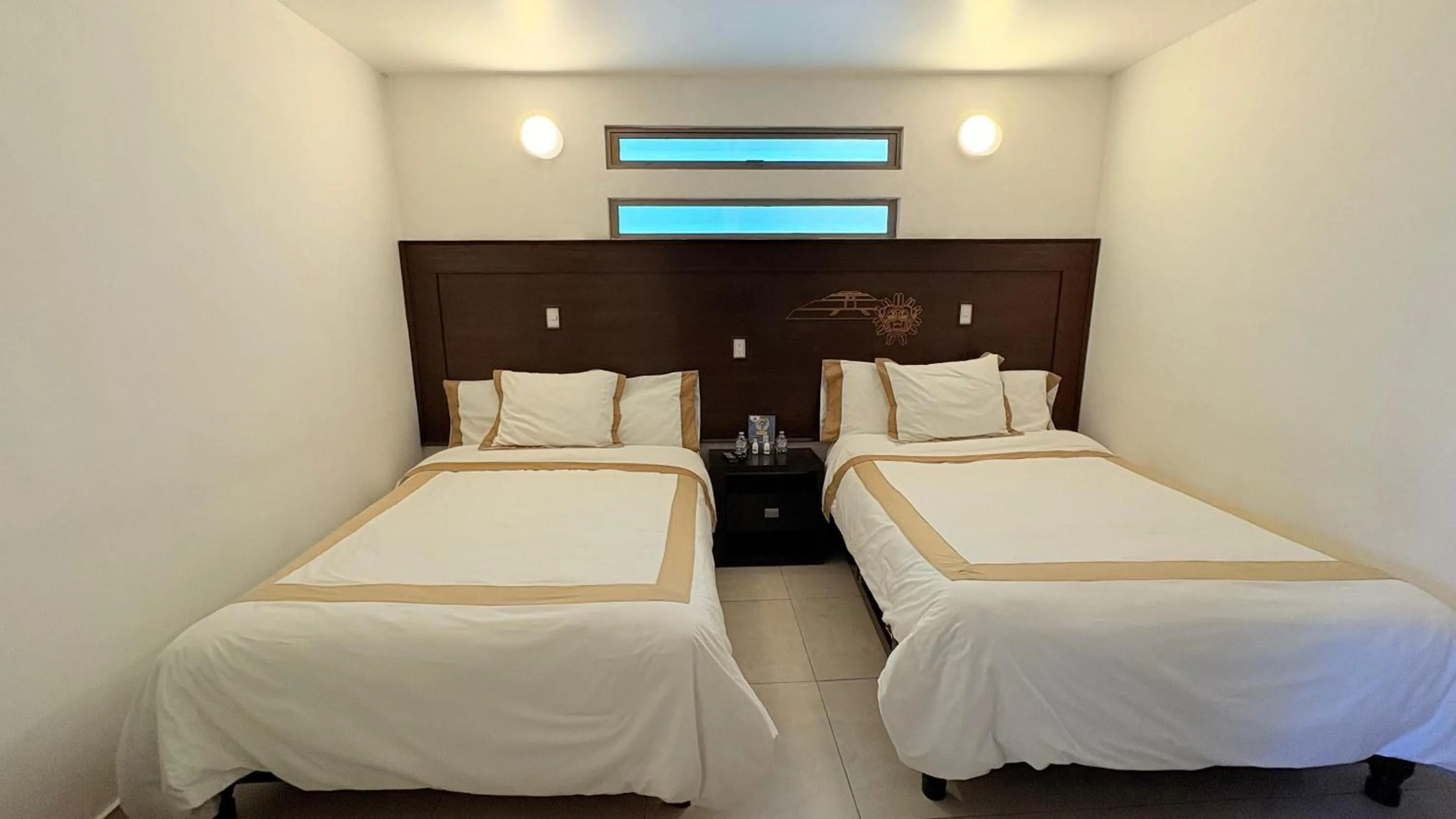 Bed in Hotel Boutique Yaocalli