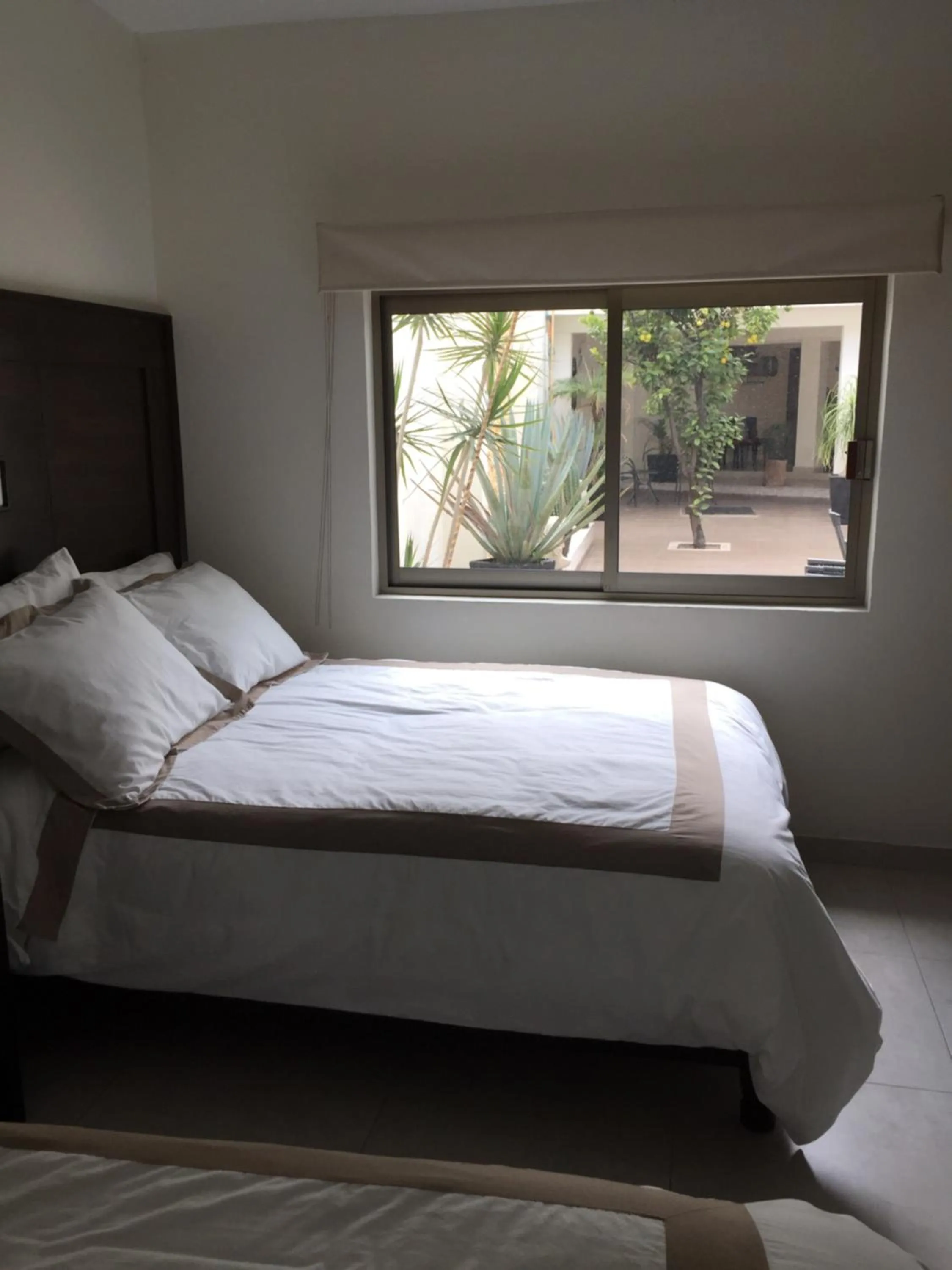 Bed in Hotel Boutique Yaocalli