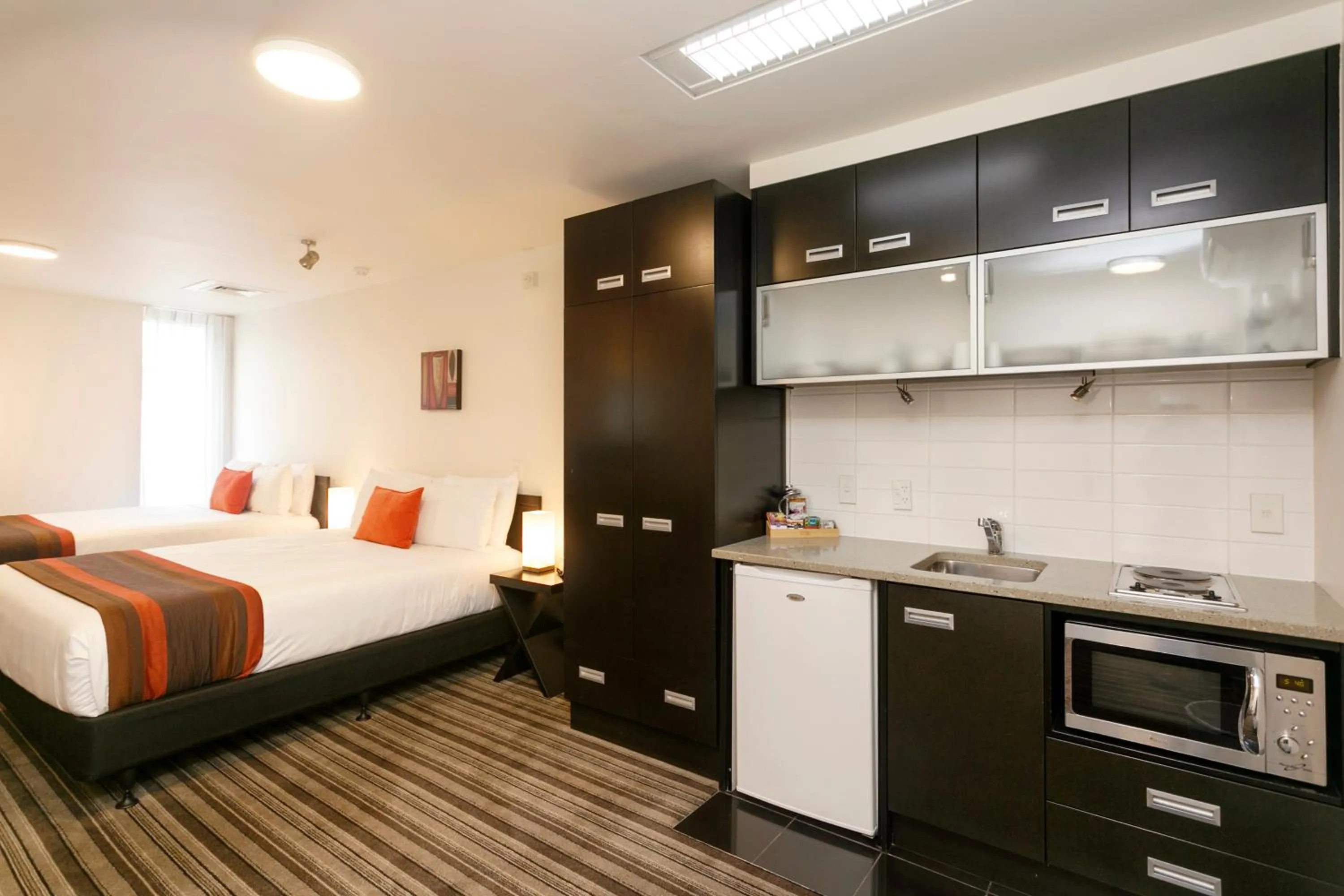 Kitchen or kitchenette, Bed in The Reef Resort