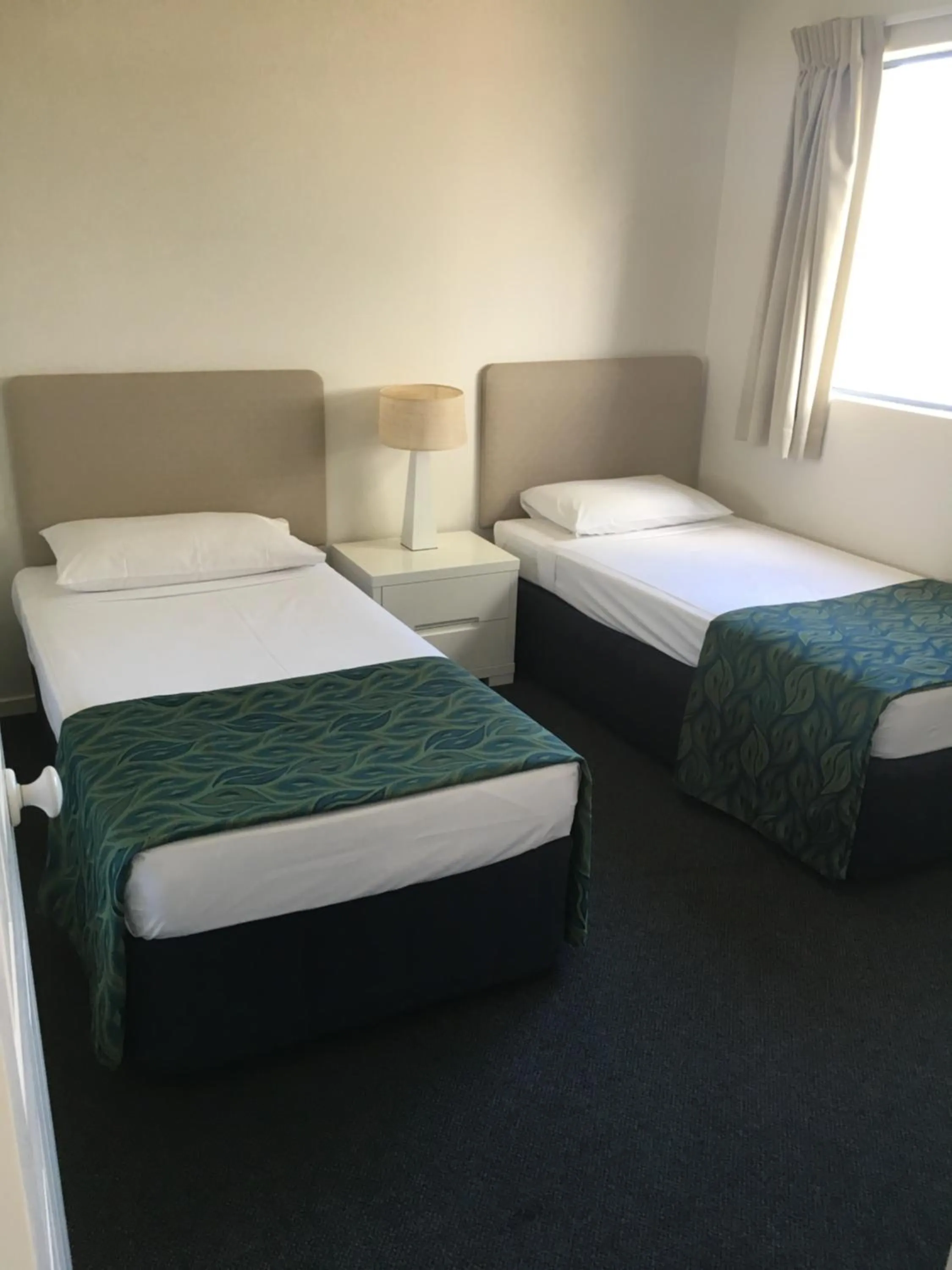 Bed in Portobello Resort Apartments