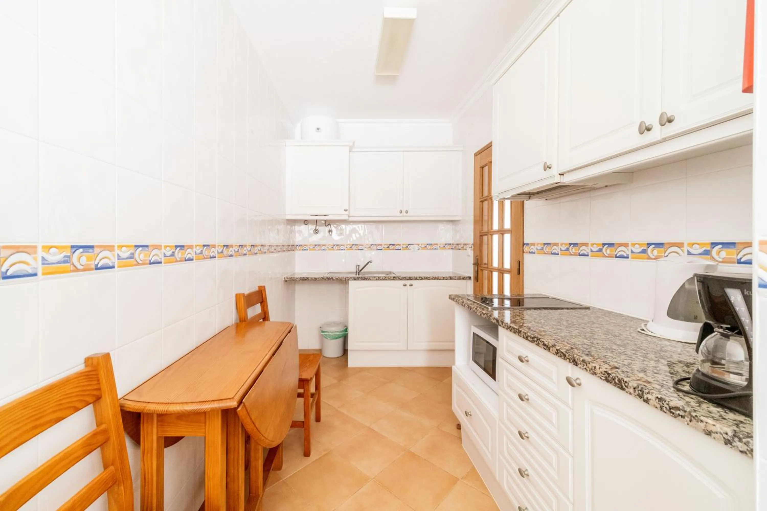 kitchen in Oasis Beach Apartments