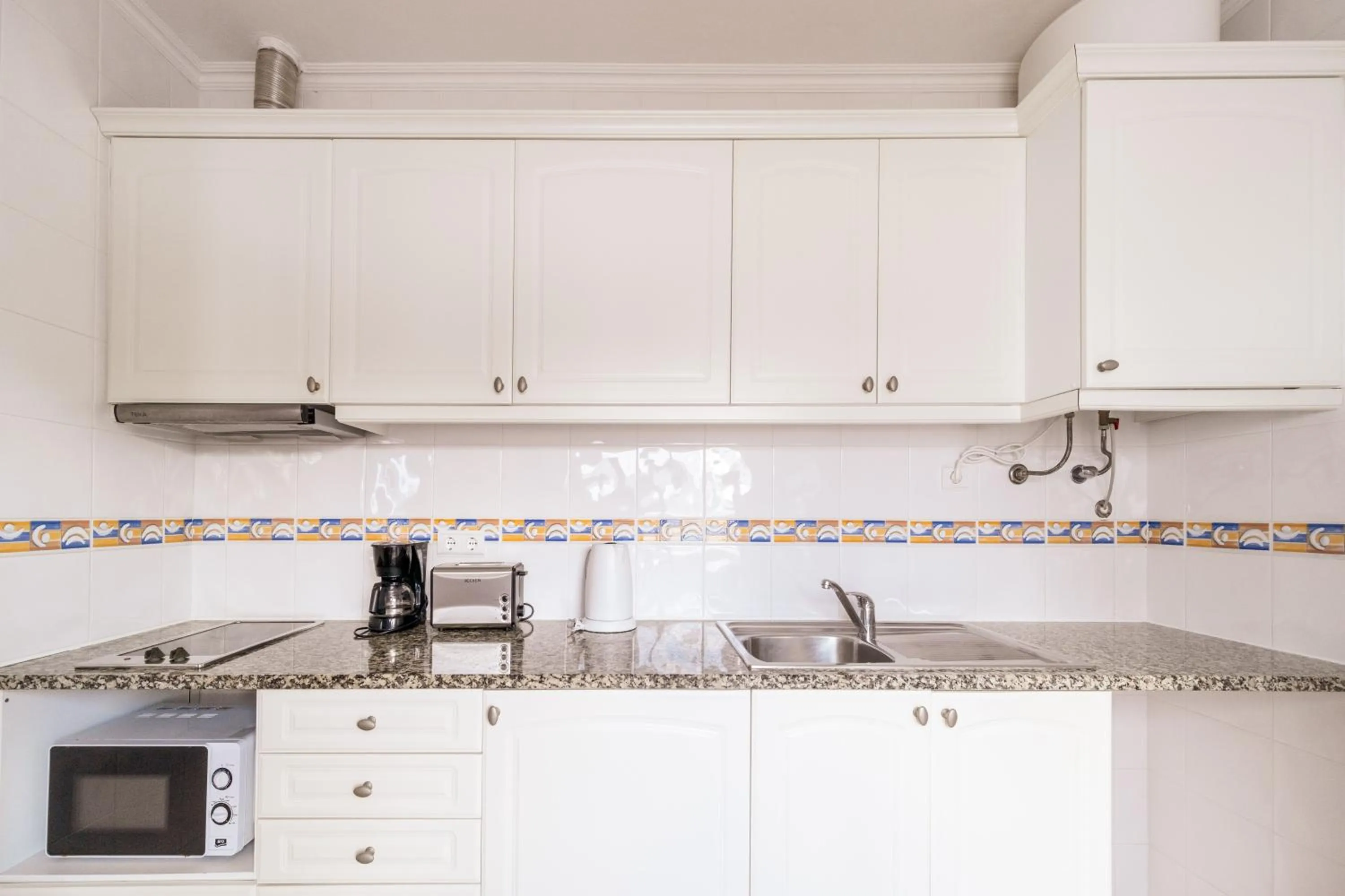 Kitchen or kitchenette in Oasis Beach Apartments