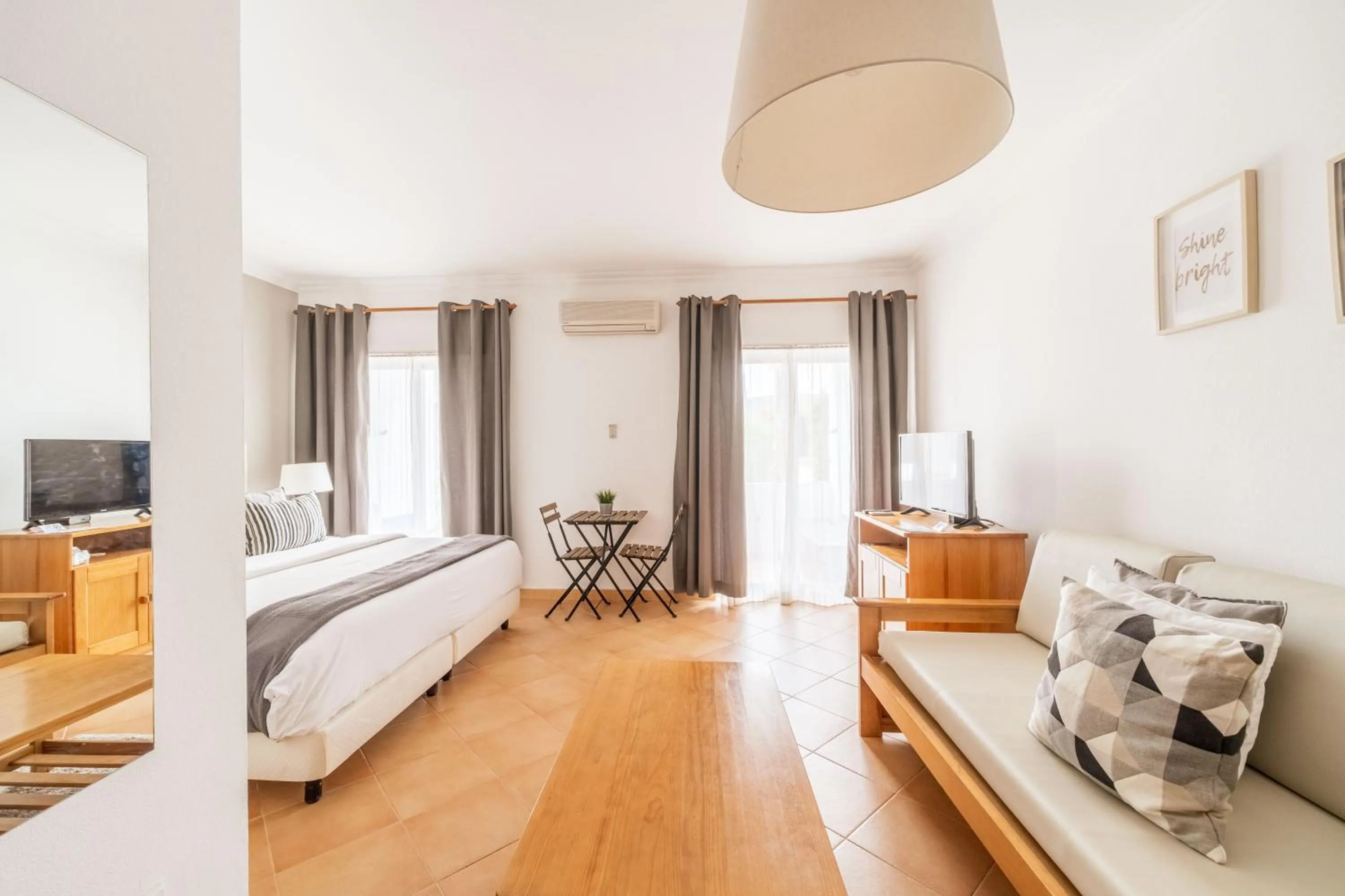 Bed in Oasis Beach Apartments