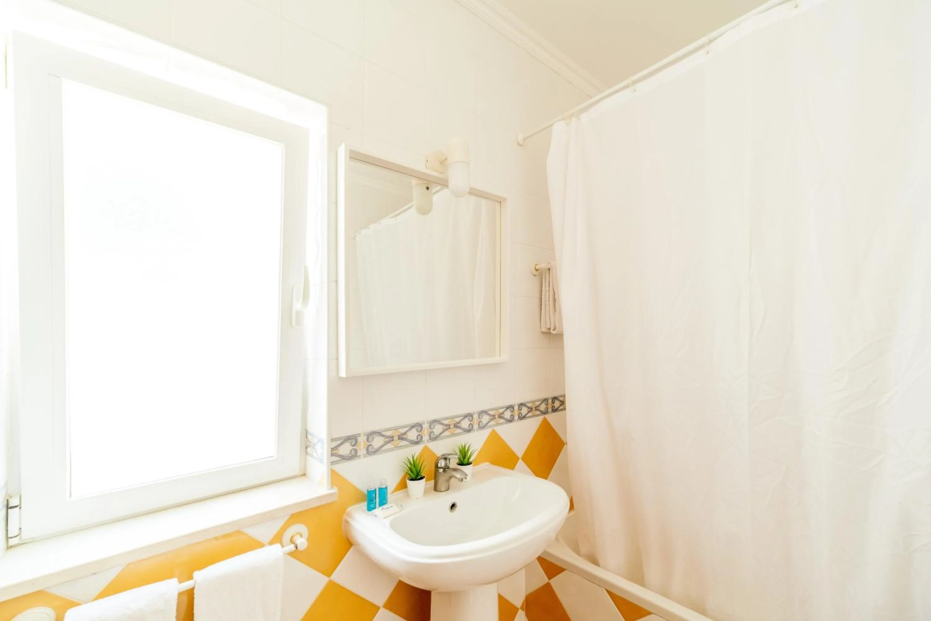 Bathroom in Oasis Beach Apartments
