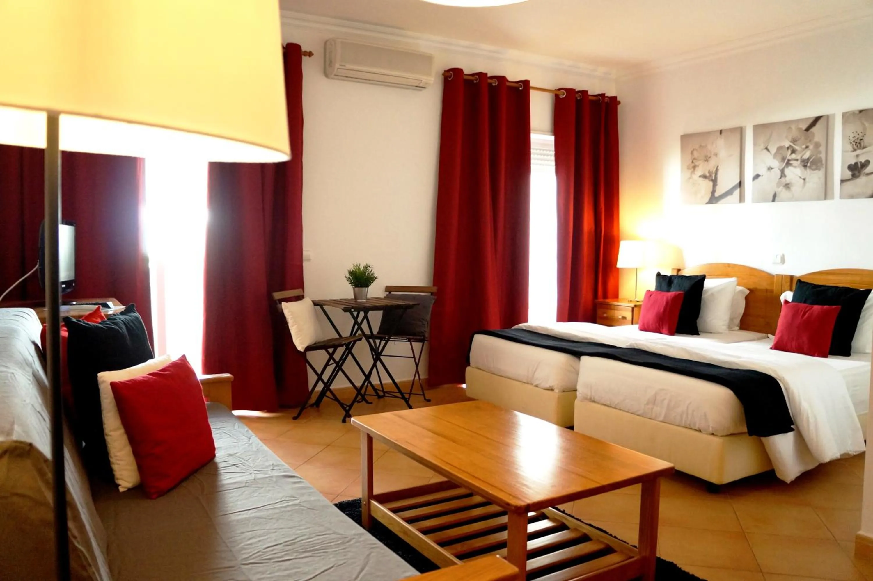 Bed in Oasis Beach Apartments