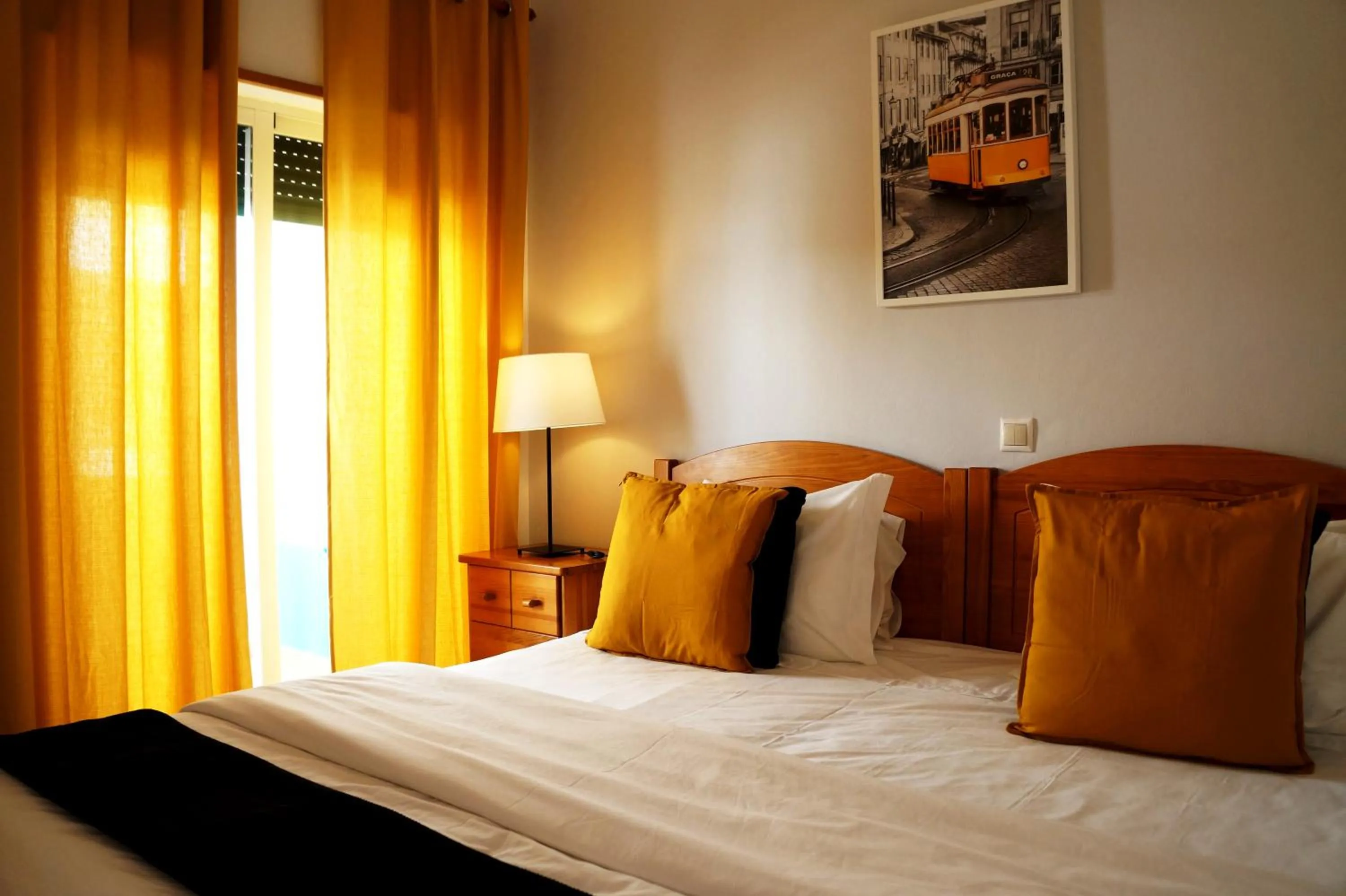 Bed in Oasis Beach Apartments