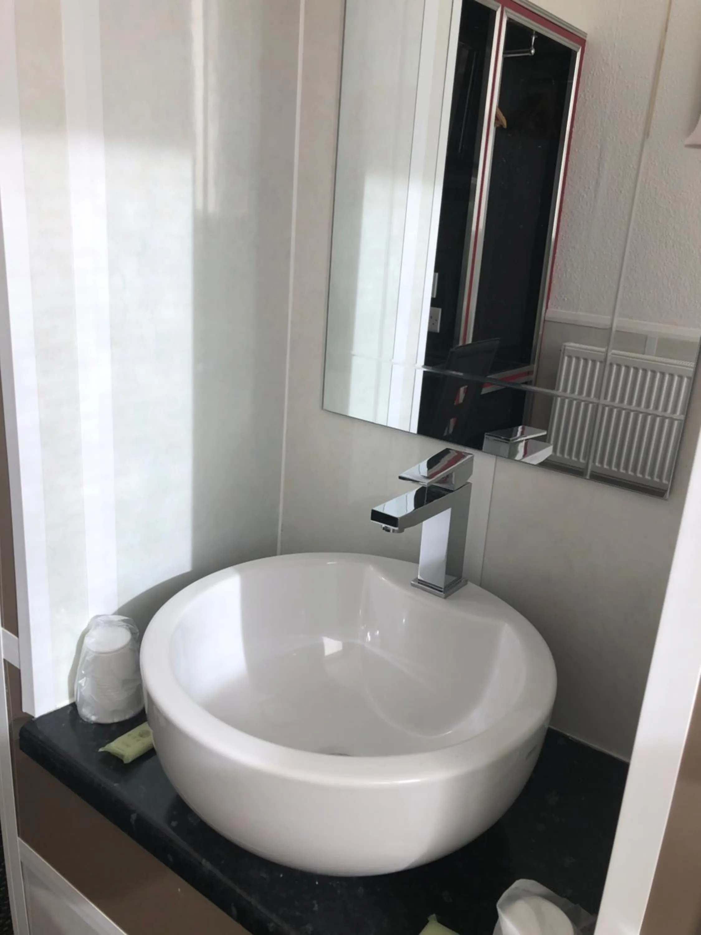 Bathroom in OYO The Bentleys Hotel