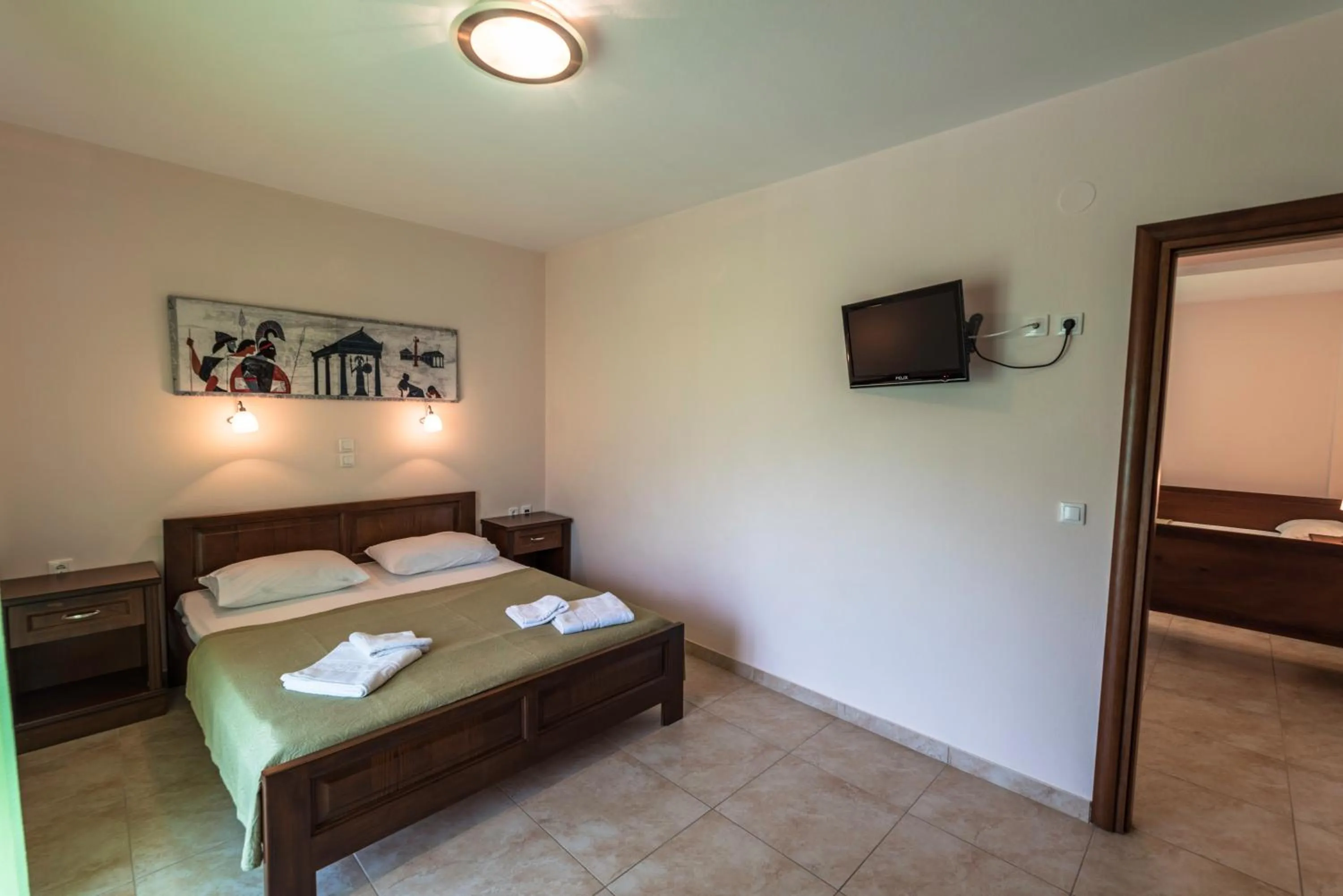 Bed in Zeus Apartments