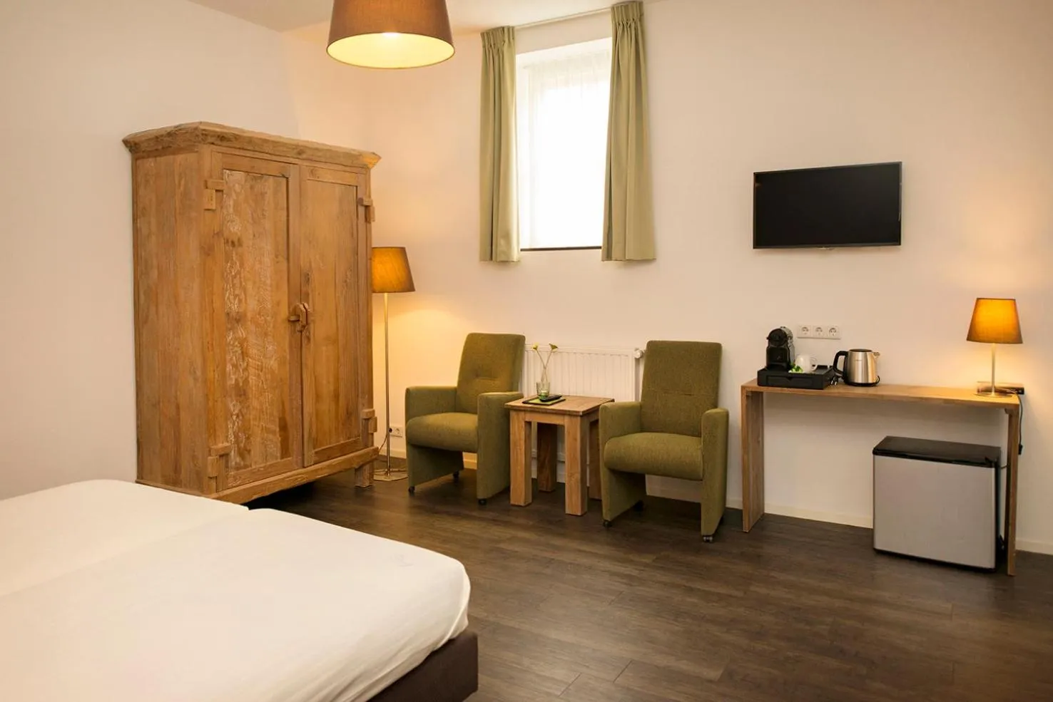 Seating area, Bed in Hoevehotel 'Hof Christina'