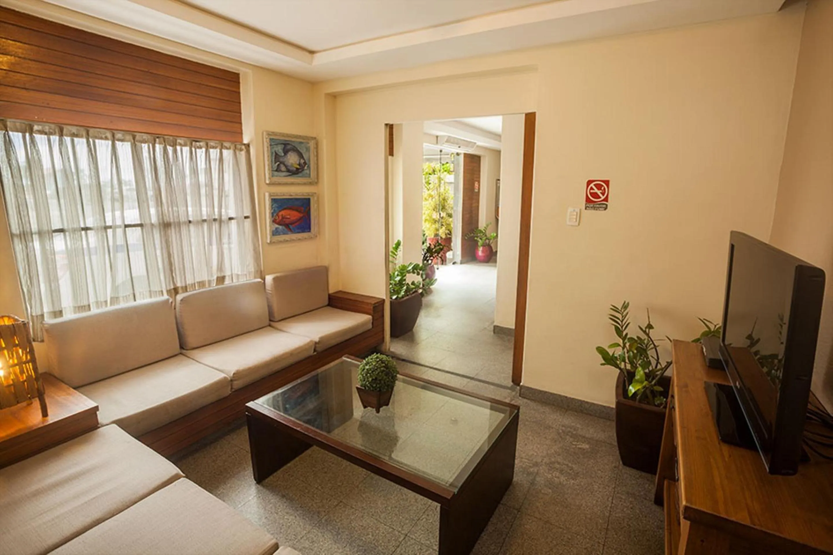 Living room in Portal Da Praia Hotel